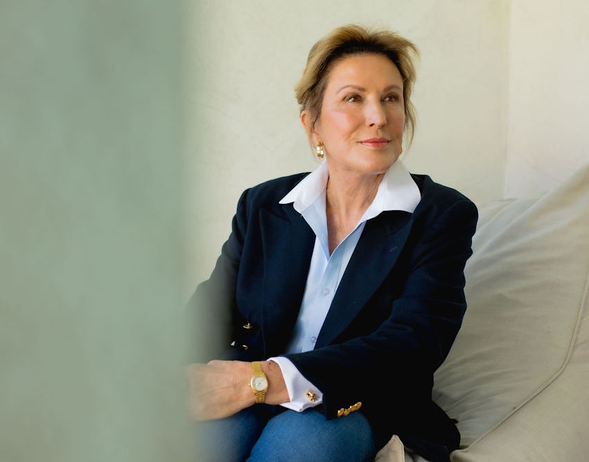 Woman sitting down and smiling