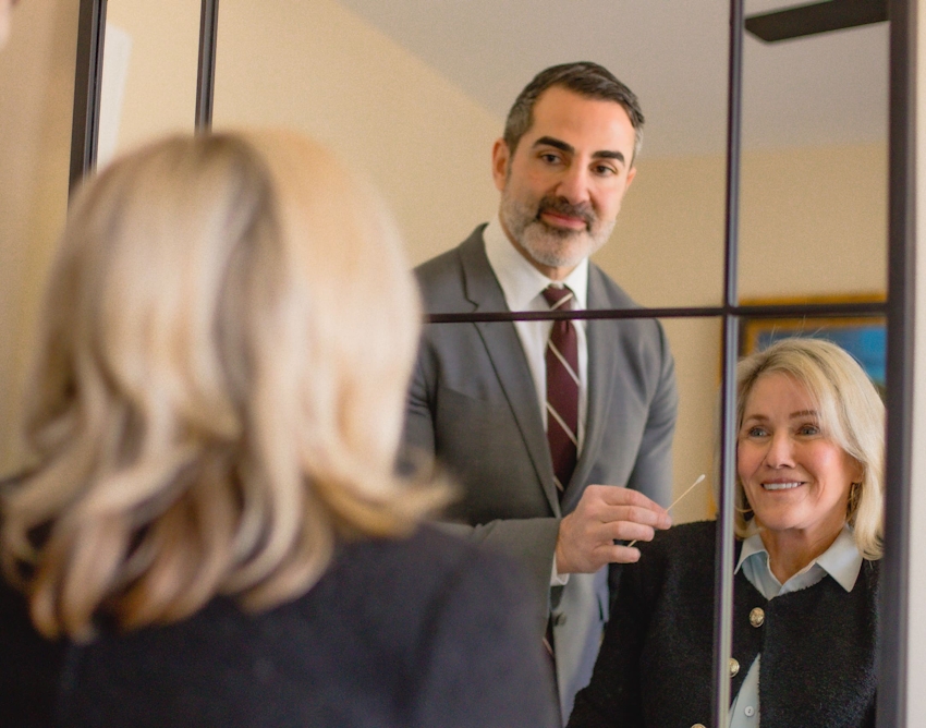 Doctor and patient looking in the mirror