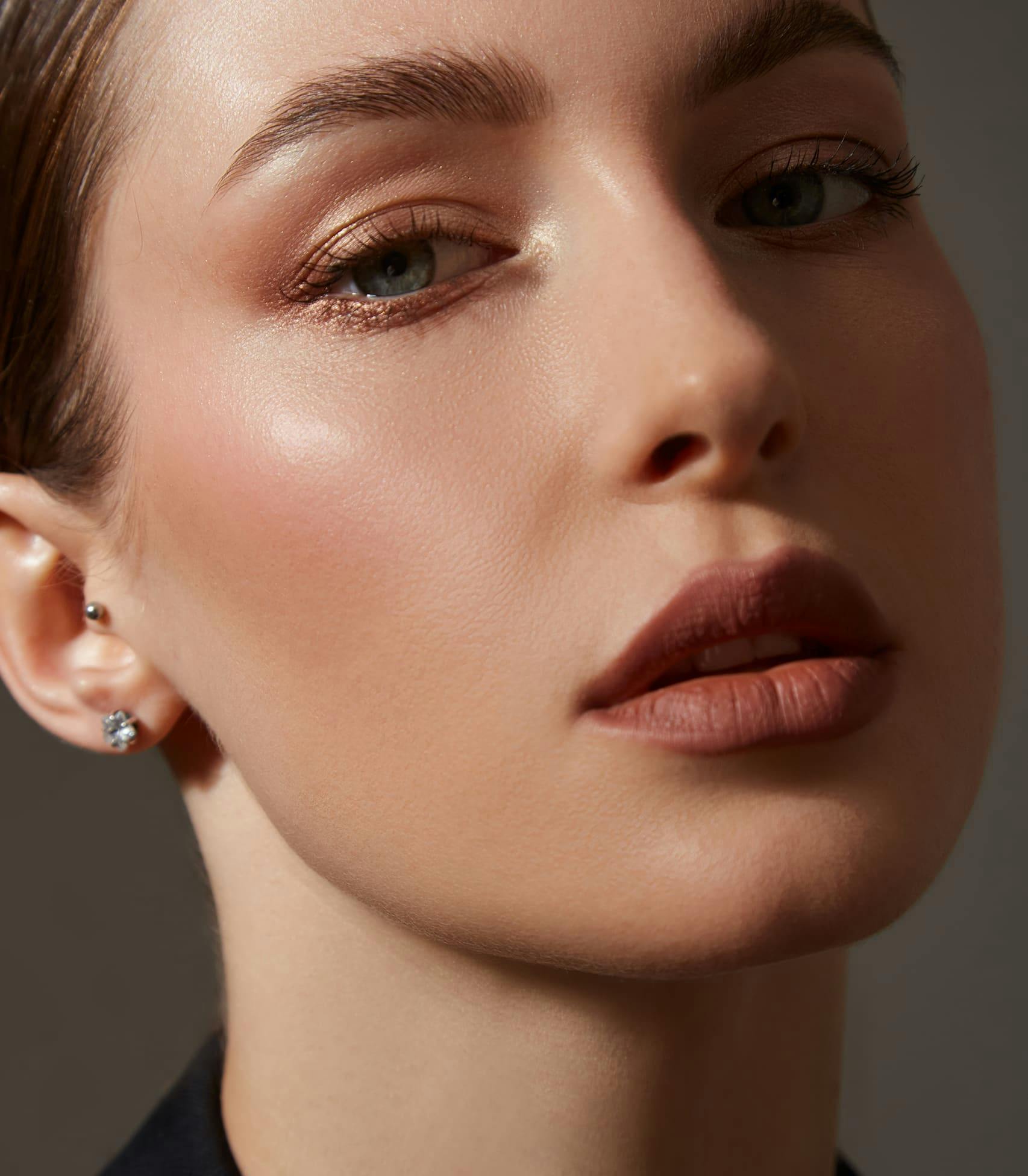 close-up of woman wearing lipstick and makeup