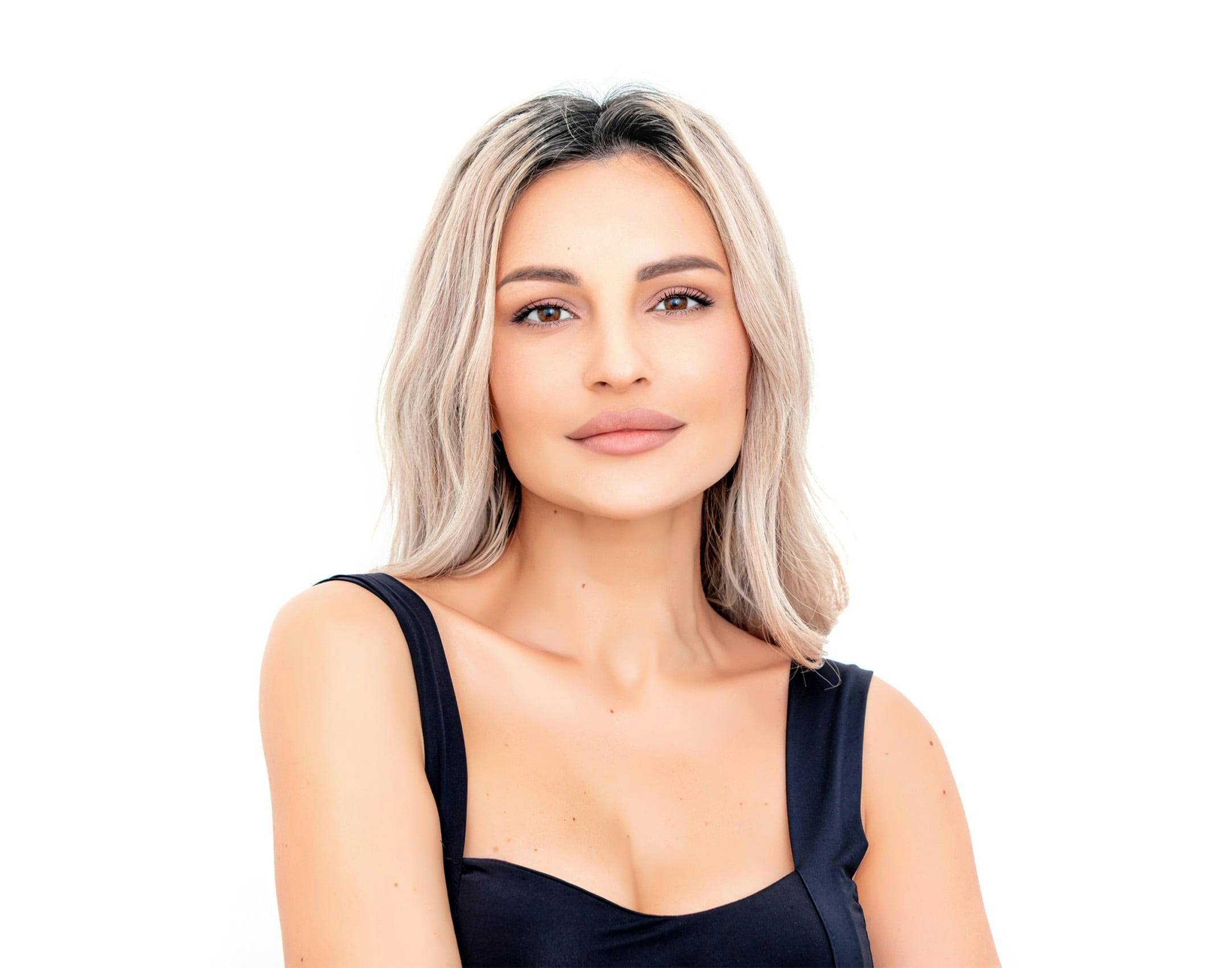 woman with blonde hair wearing a black top