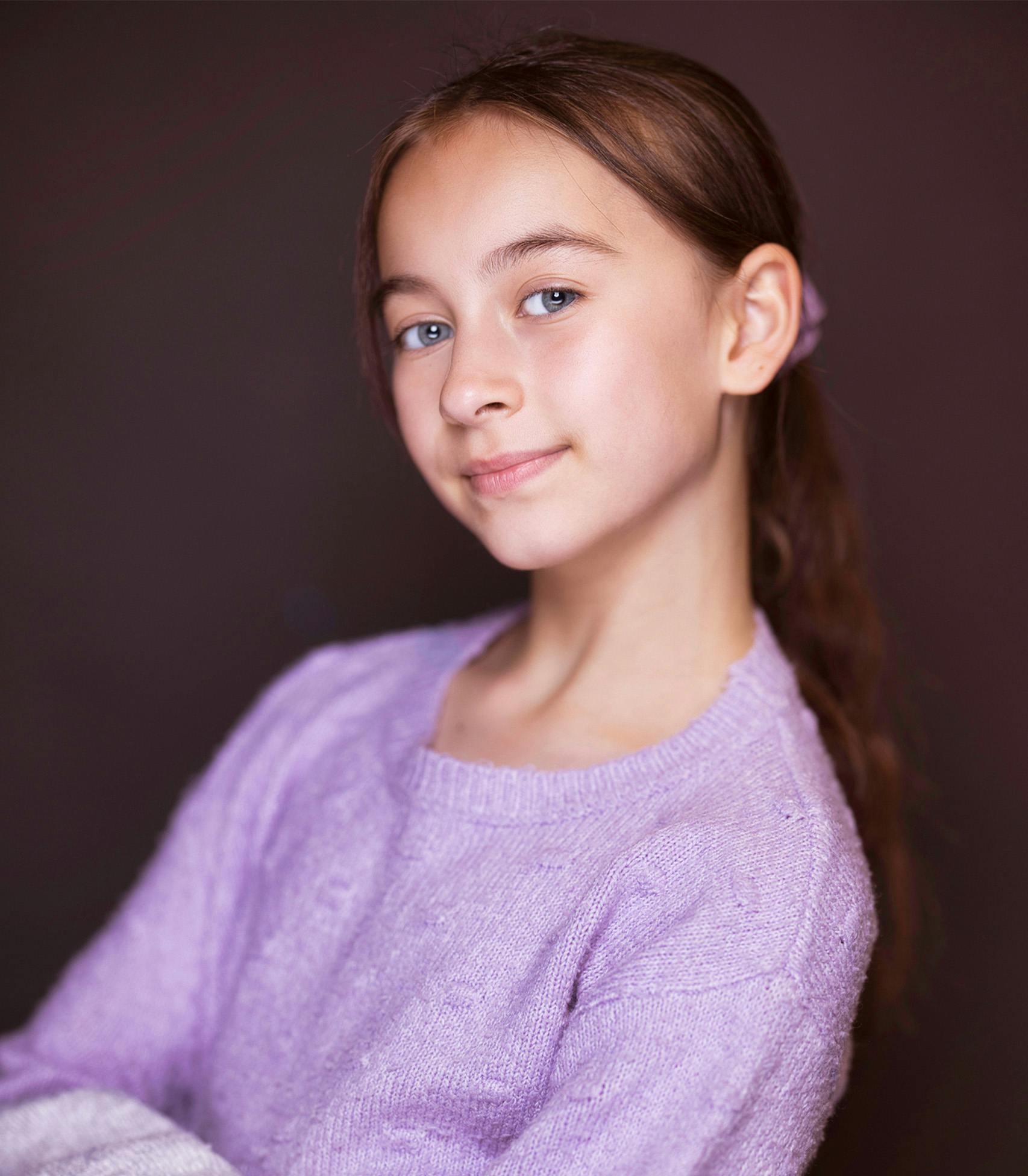 young girl in a purple shirt