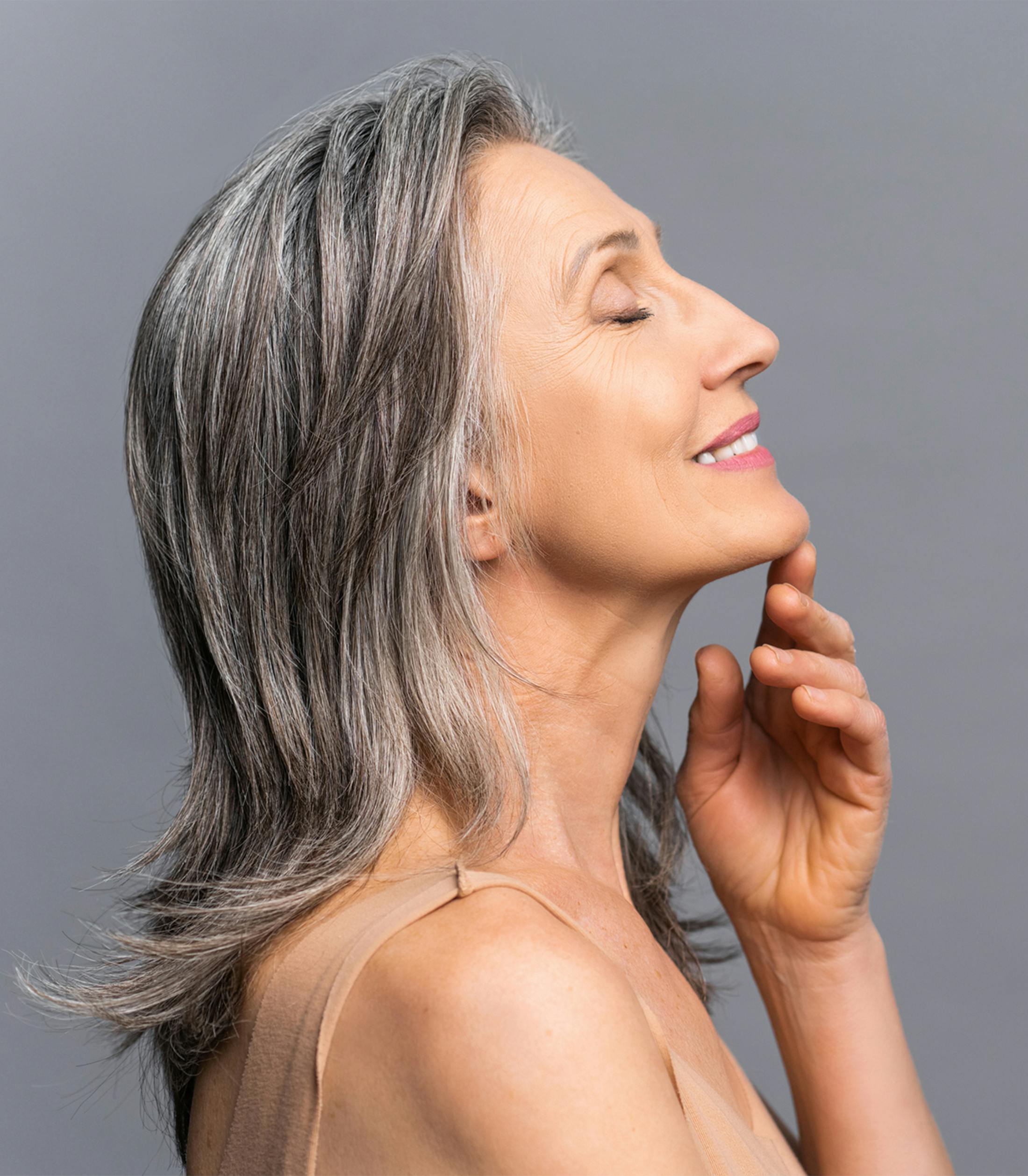 woman with grey hair smiling