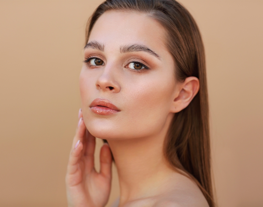 woman touching her chin
