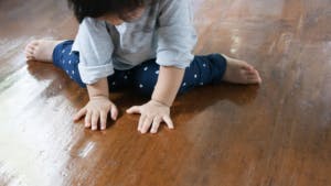 child on hard floor