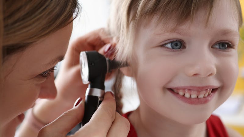 child undergoing an ear exam