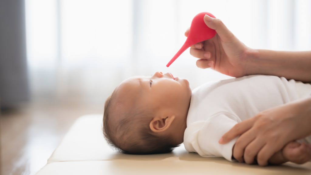 baby getting their nose unstuffed