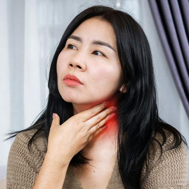 Woman with a Sore Throat