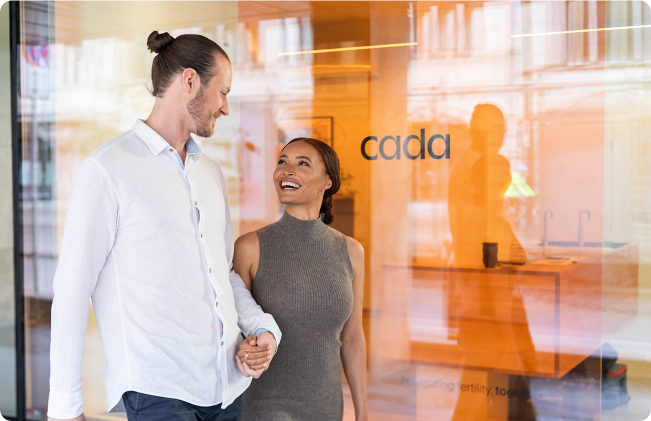 Couple walking in front of cada clinic