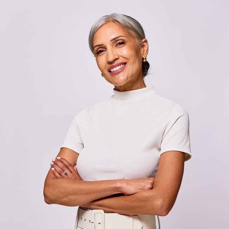 smiling woman crossing her arms