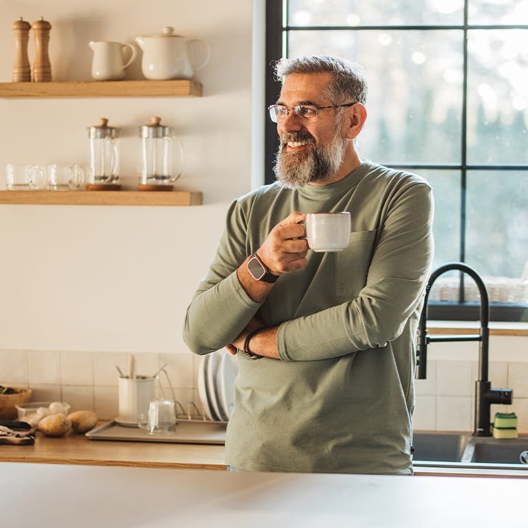 older man drinking coffee