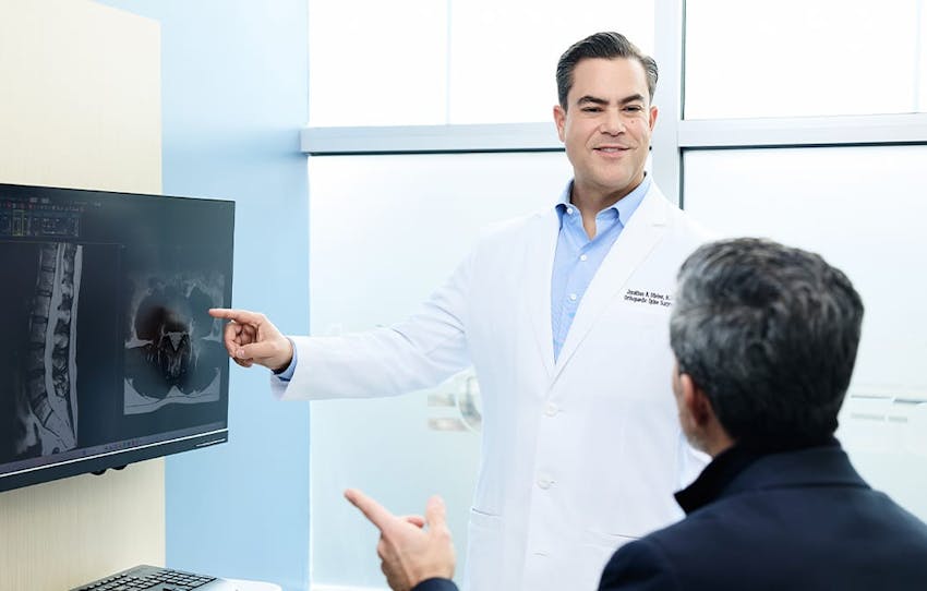 doctor pointing at an x-ray