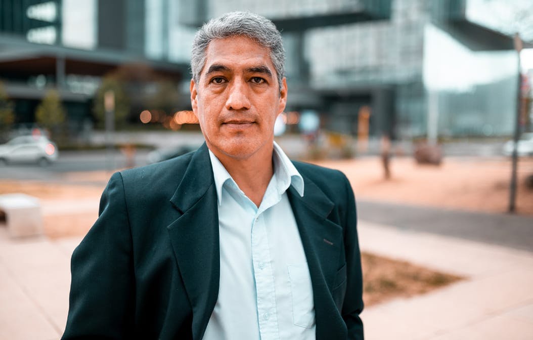 older man standing outside