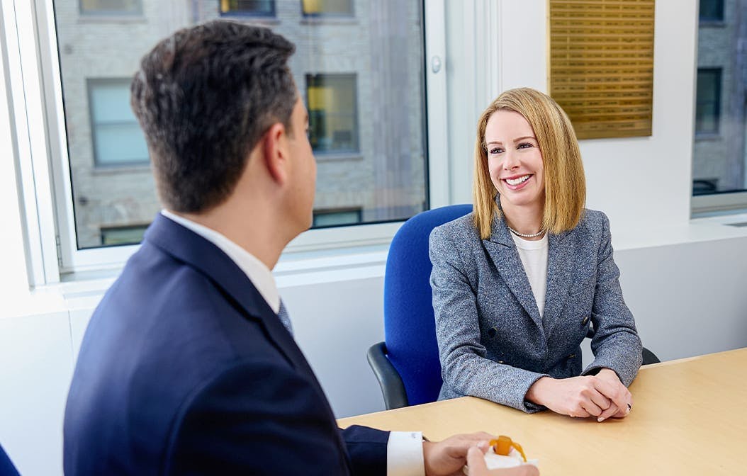 doctor talking to a woman at a table
