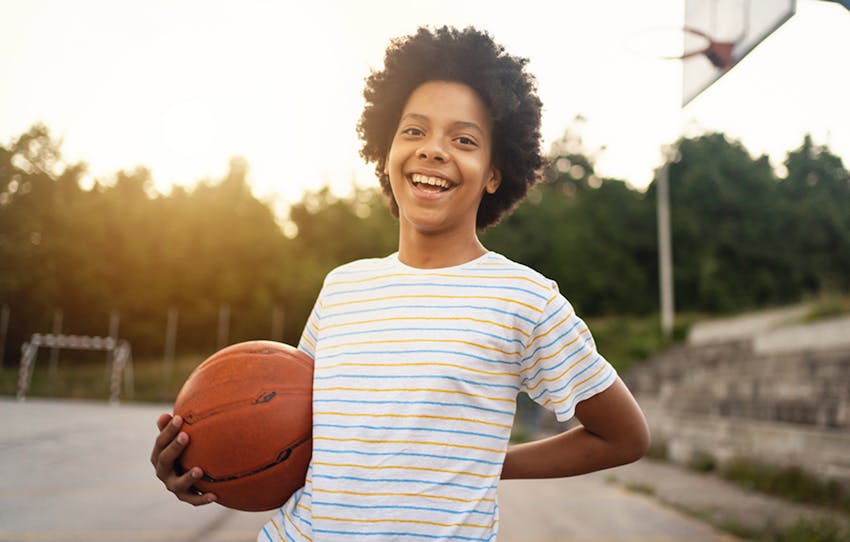 young kid with a basketball
