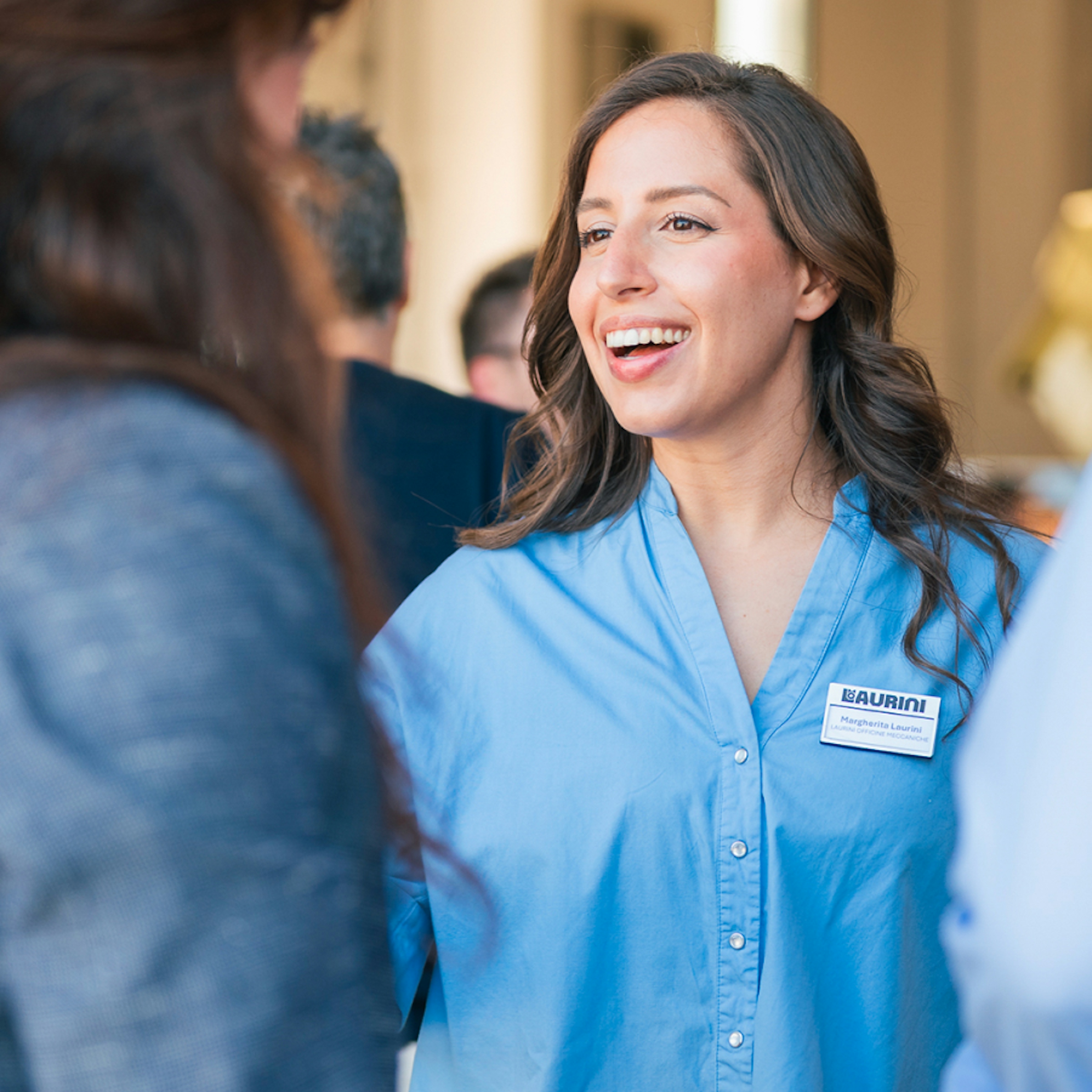 Margherita smiling in a conversation