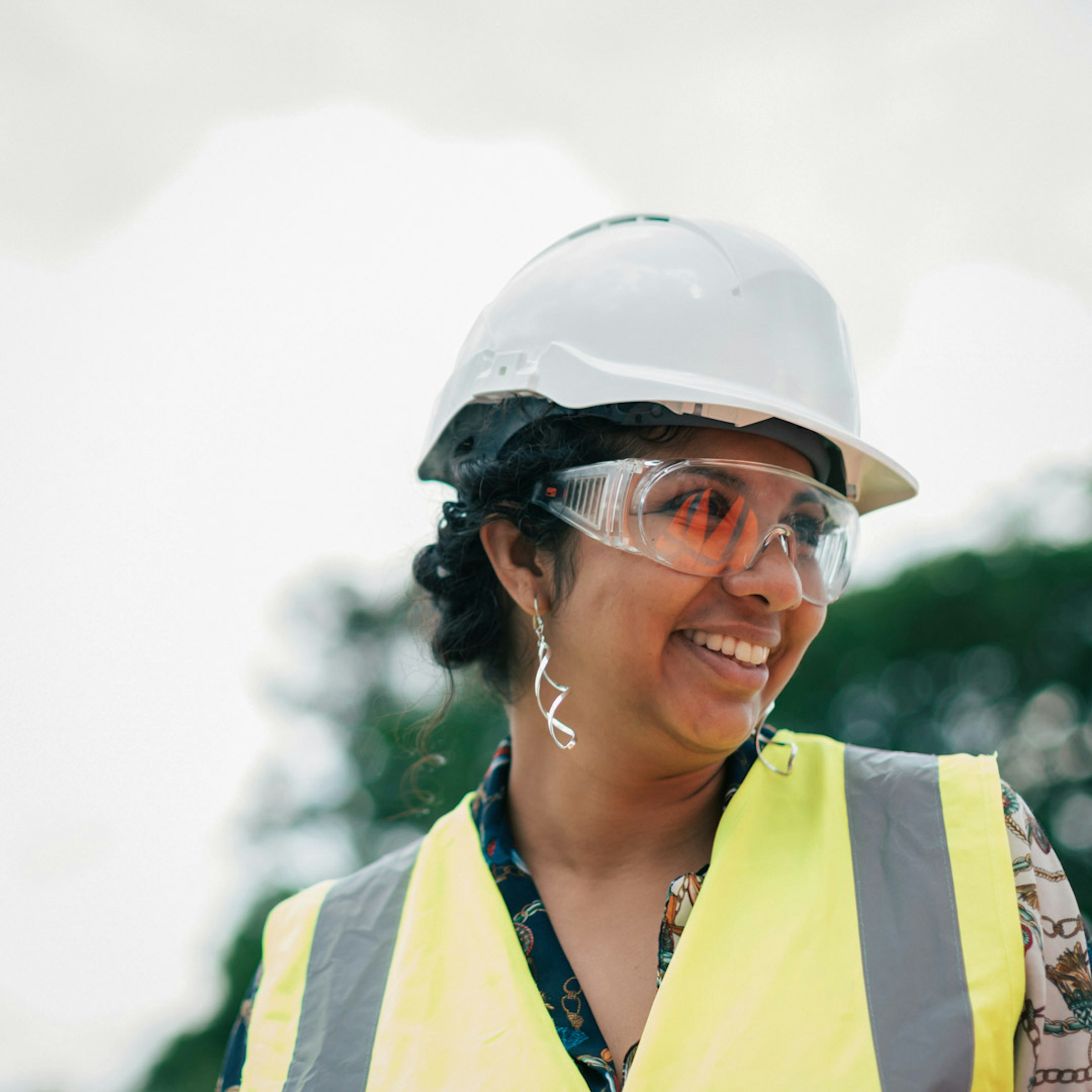 Woman in a white hard hat
