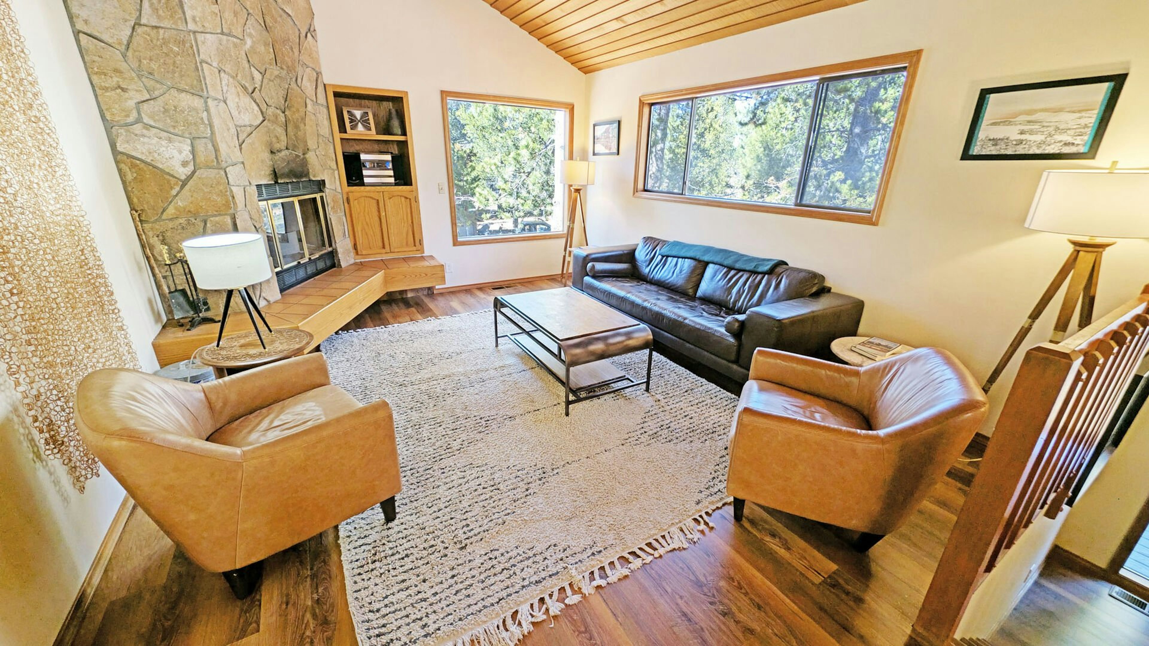 The living area features a classic Sunriver Lava Rock face Fireplace