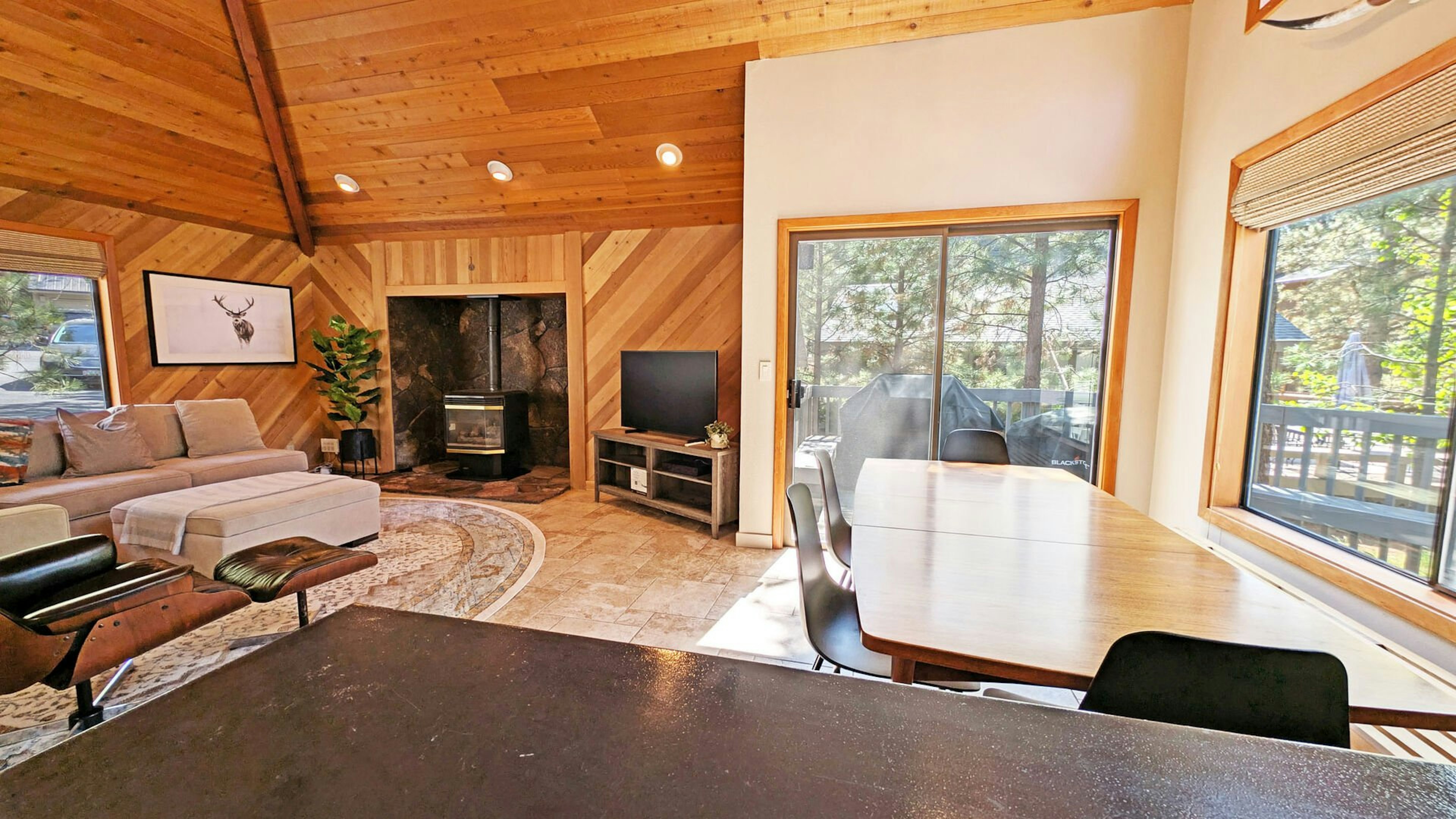 The Dining area sits next toa sliding glass door that leads to the deck.