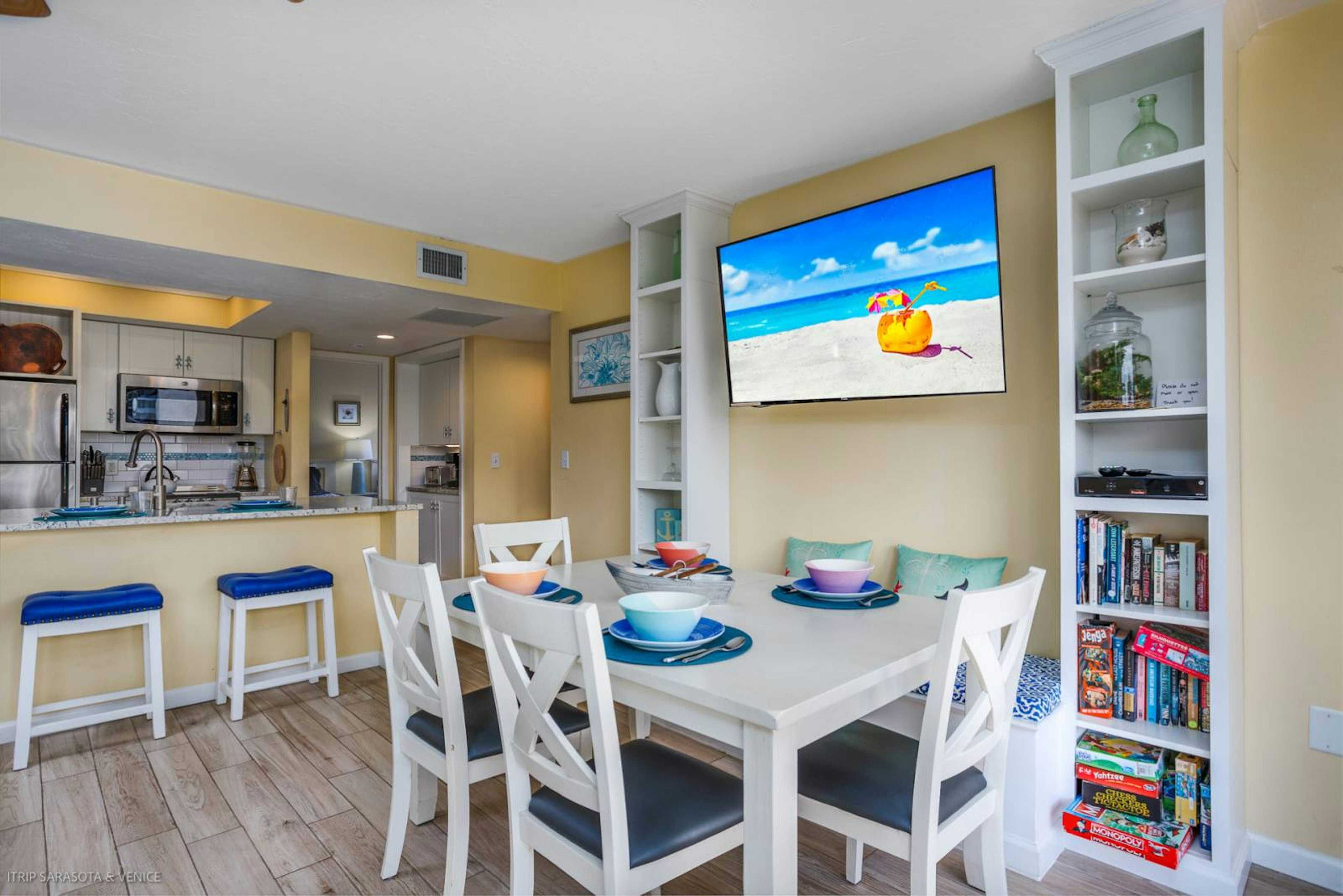 Your coastal retreat features an open dining area with beach views on TV, perfect for family meals and game nights.