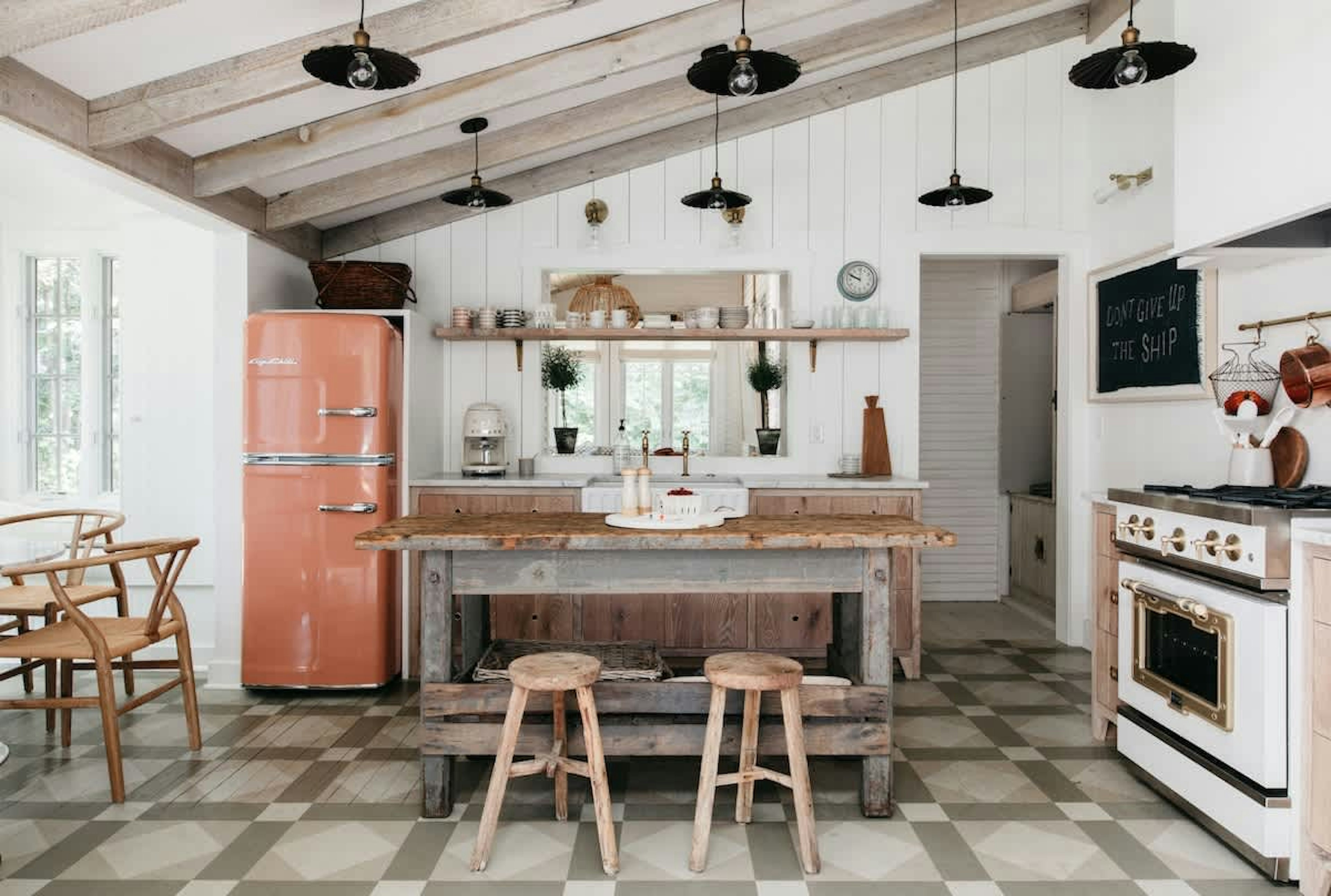 The kitchen has been updated to include many modern amenities while still retaining a vintage lake house feel.