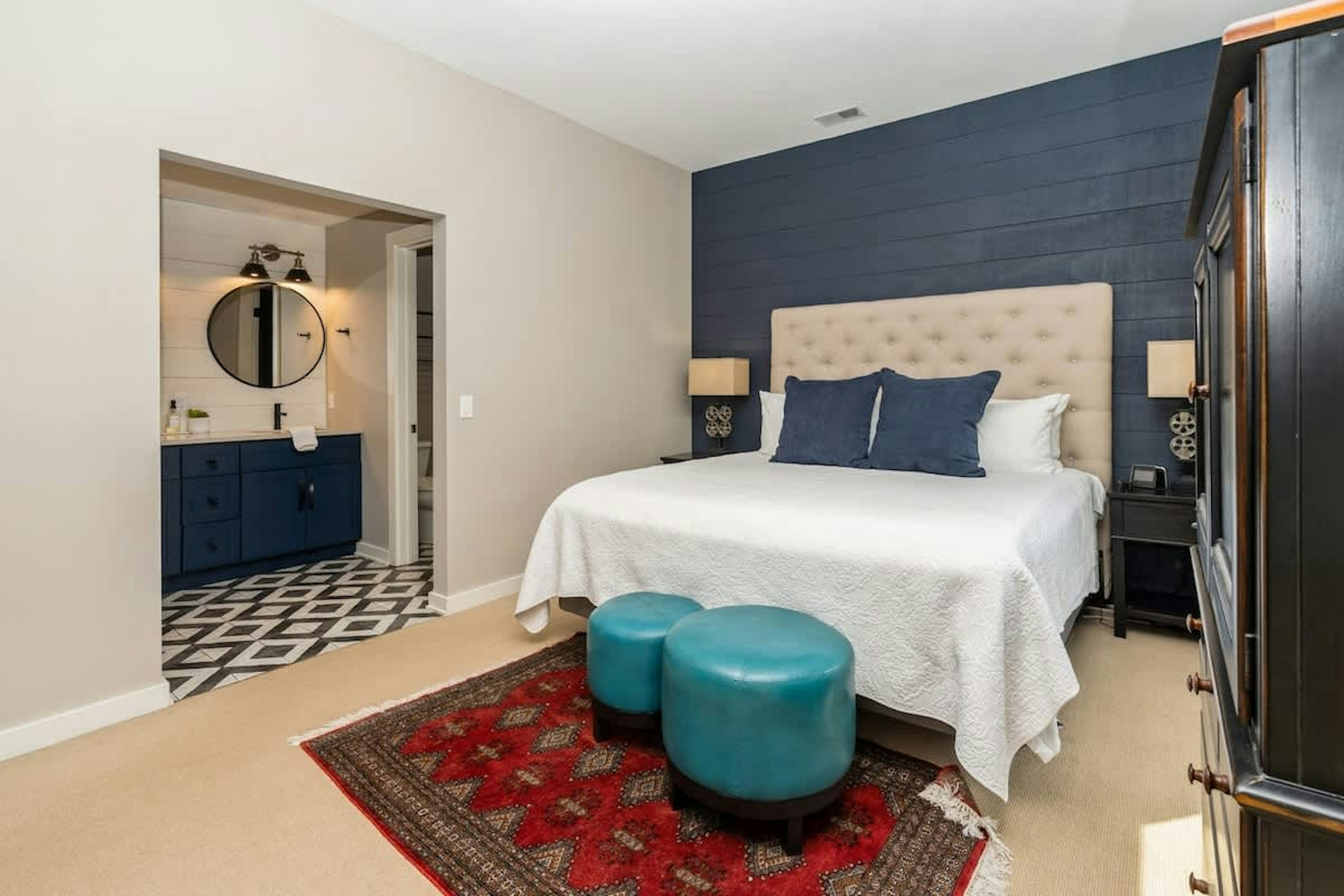 Tufted headboard. Velvet stools. Pure bliss.
