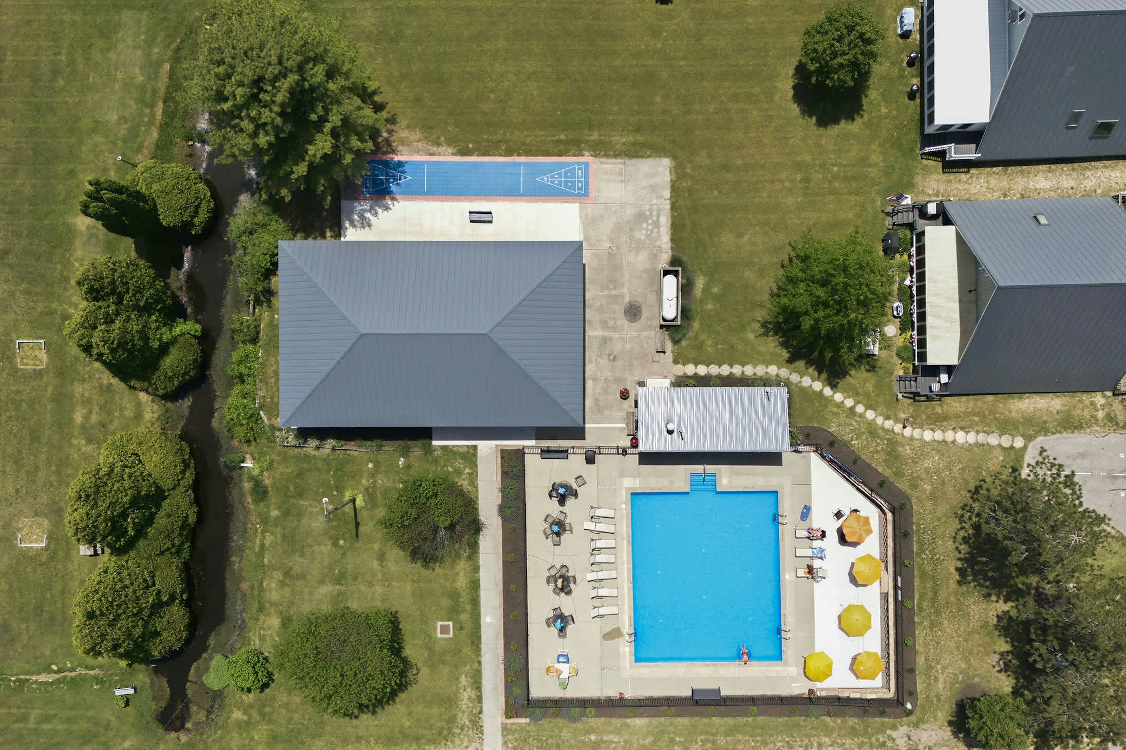 Swim, lounge, and play shuffleboard — all just steps from your chalet.