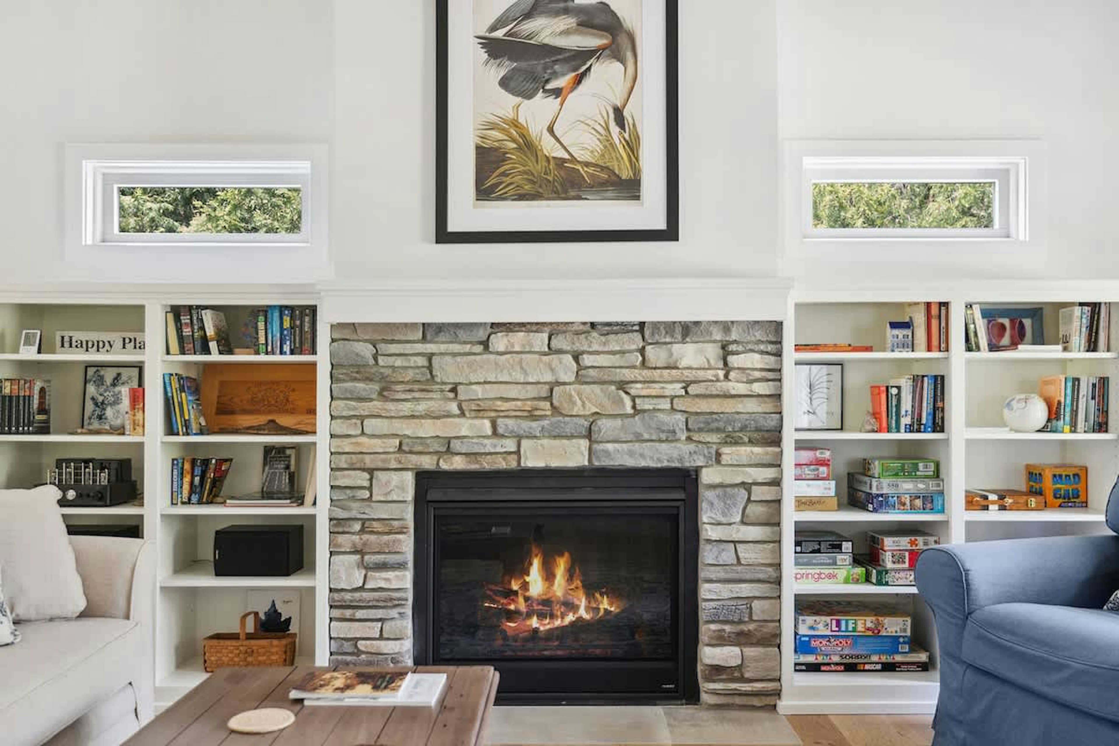 The Cottage has a cozy and inviting living room with stone fireplace.