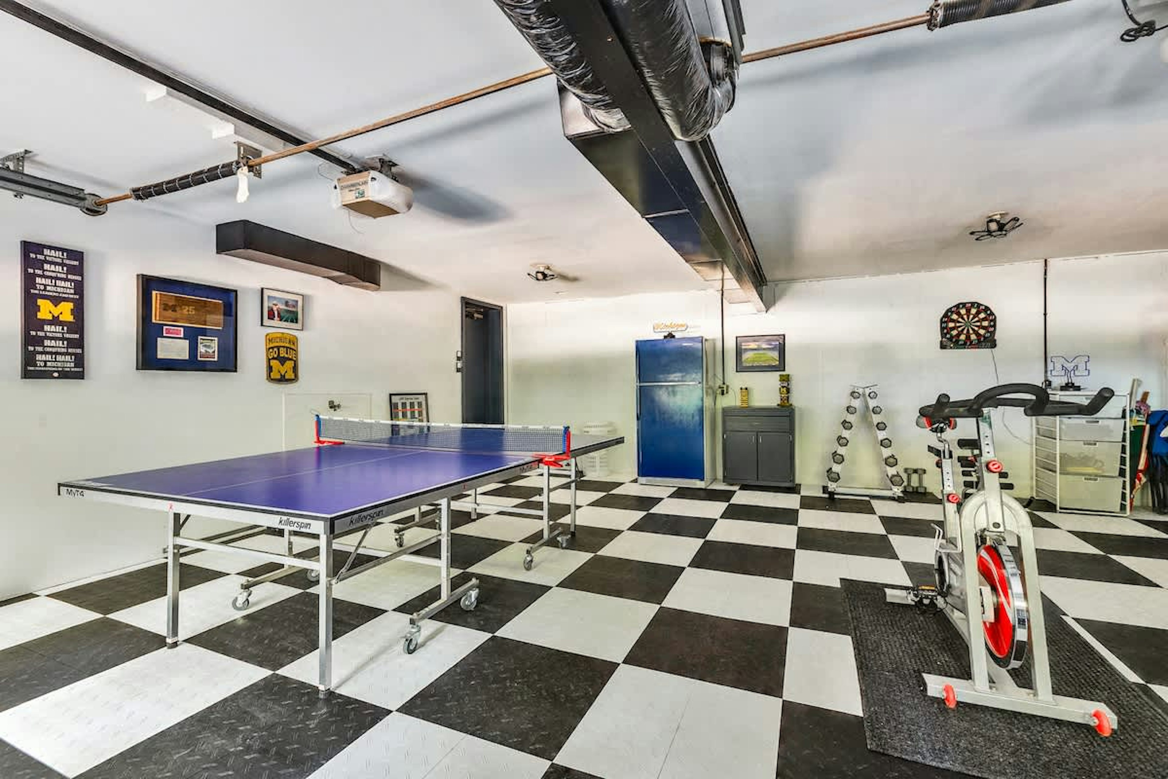 Game on! Ping pong, darts, and a mini gym right at home.