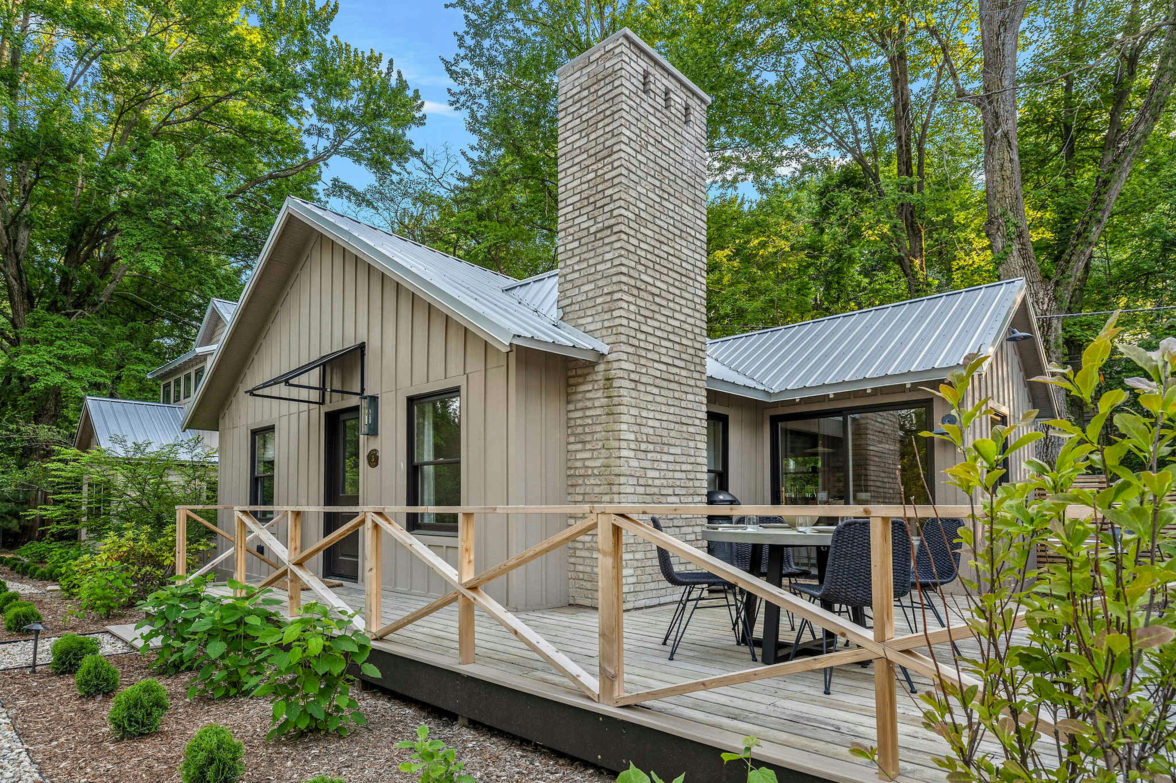 This charming cabin with a cozy deck and inviting patio is the perfect spot to unwind and soak in nature's beauty.
