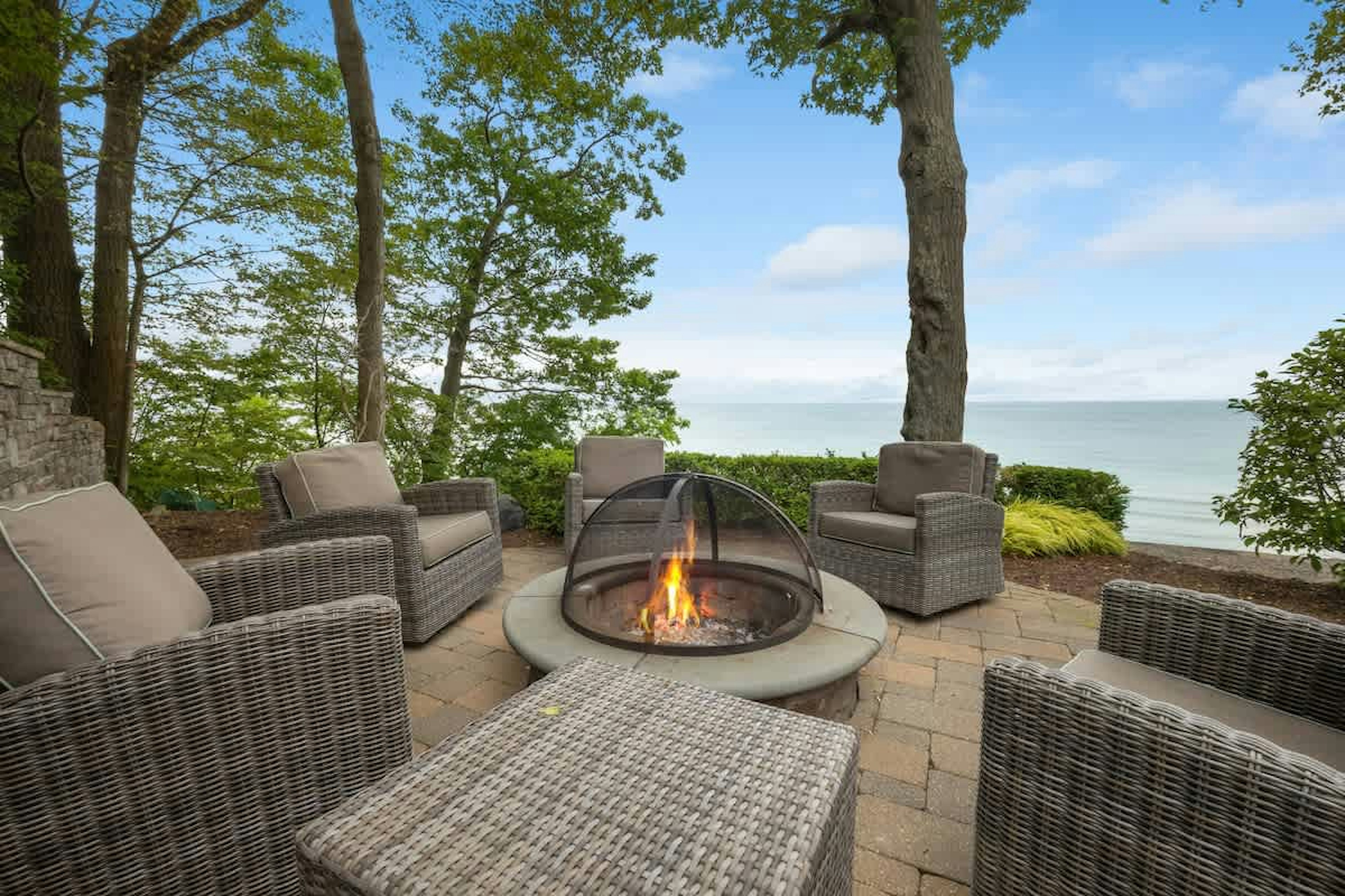 Cozy up by the fire, steps from the shore.