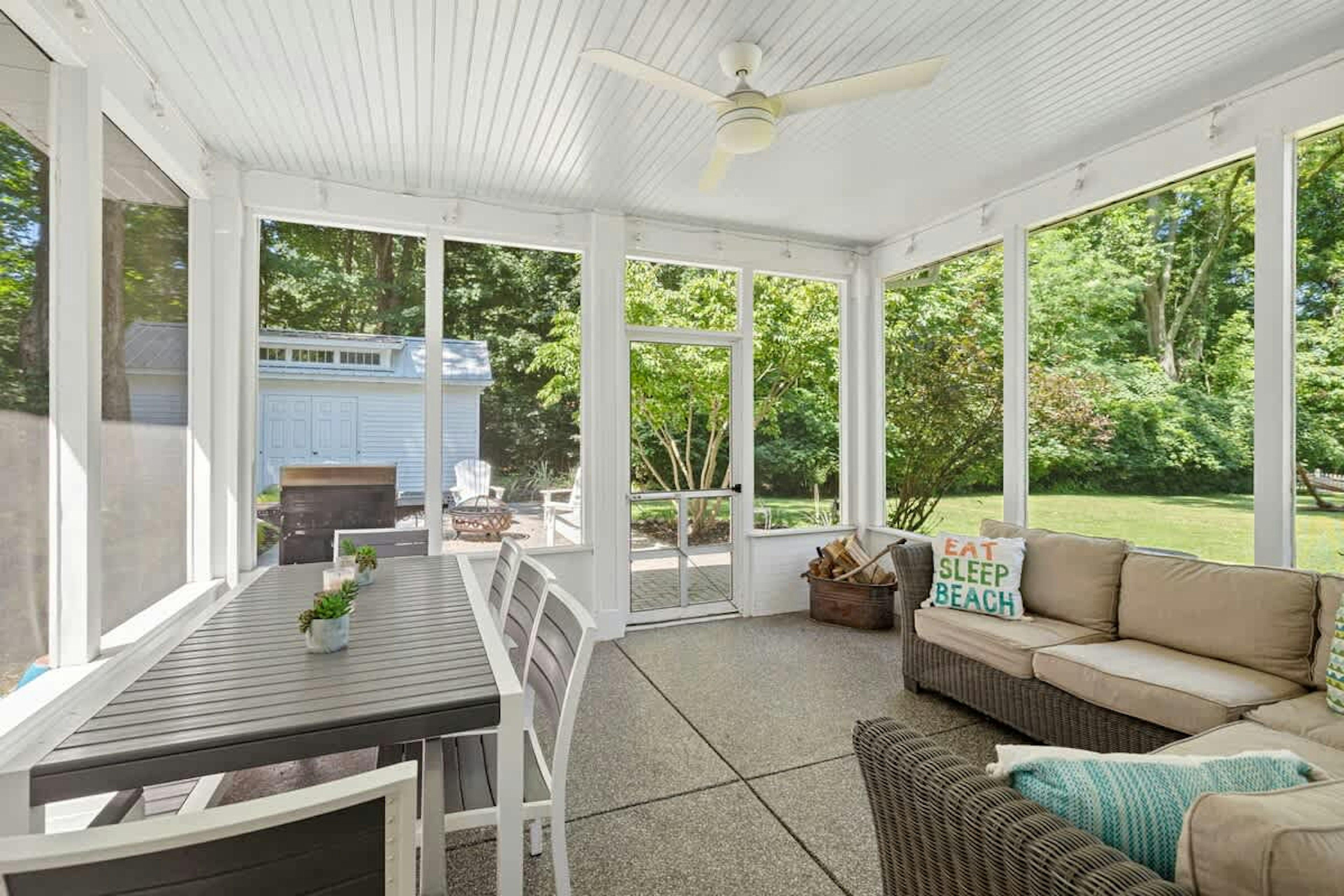 Dine, relax, and soak in the serenity—this porch is your year-round retreat.