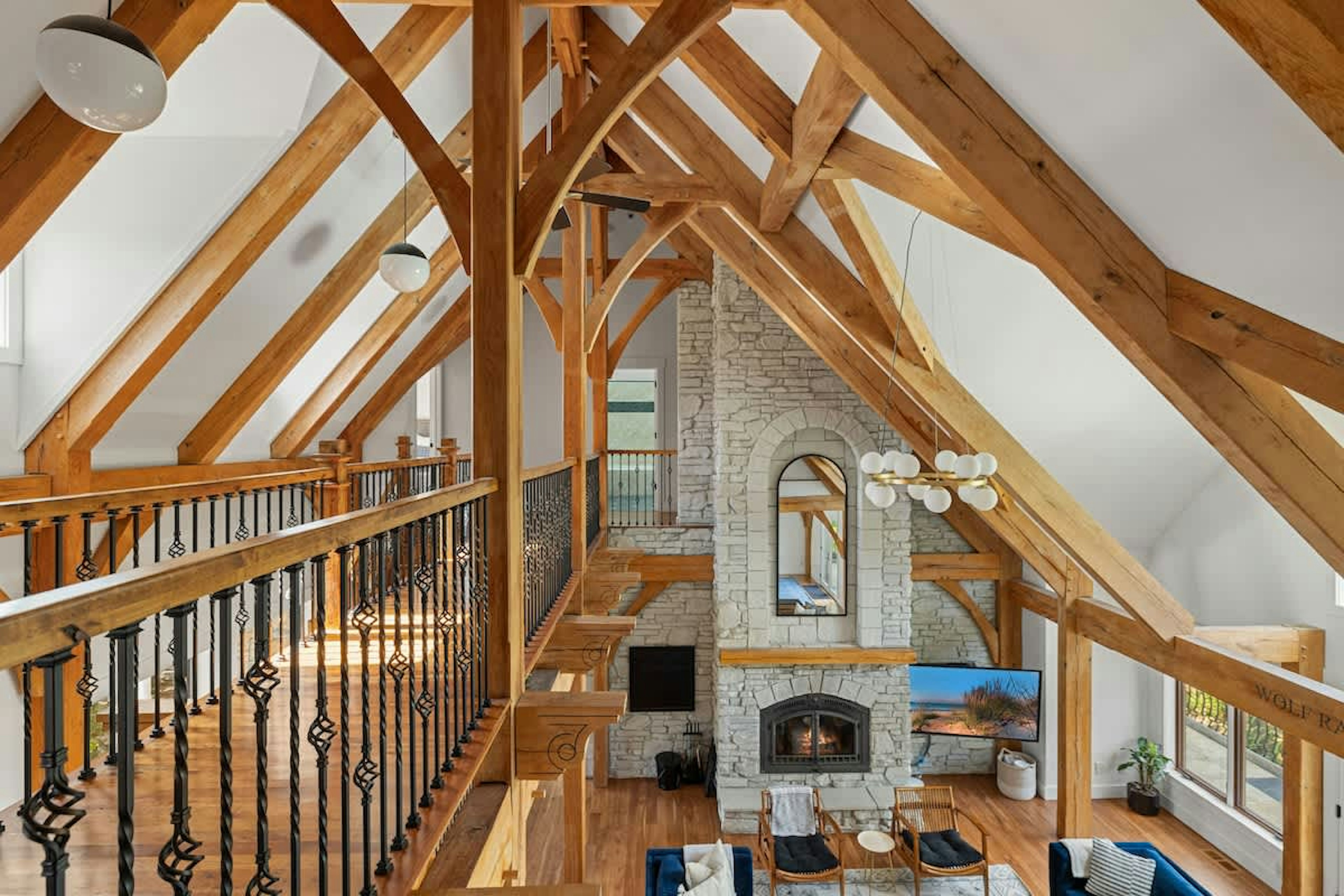 Cozy up under the beams and by the fire—this living room is everything.