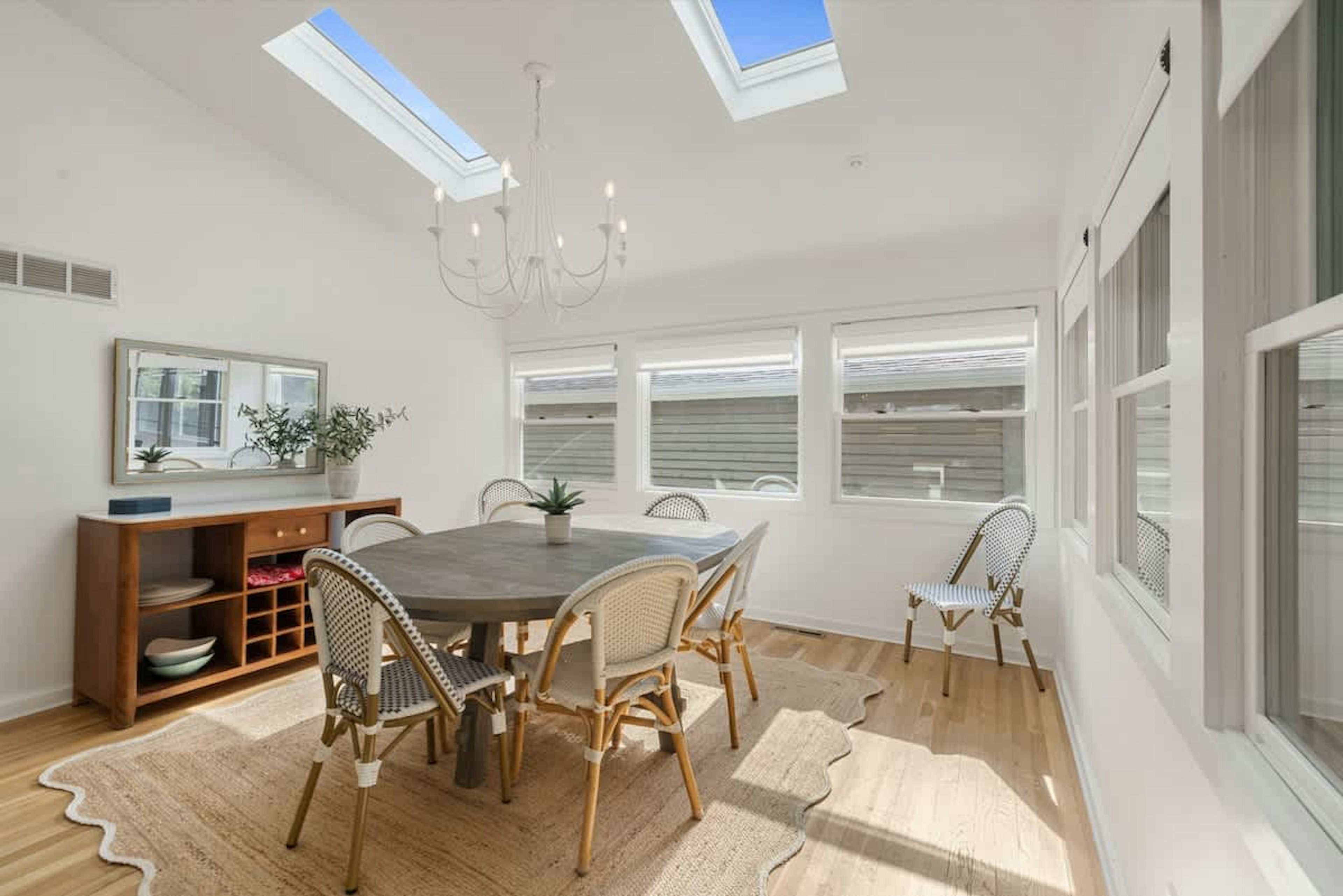 Gather, laugh, and linger longer in this sun-kissed dining room. Where refined charm meets natural light and every meal feels like a celebration!