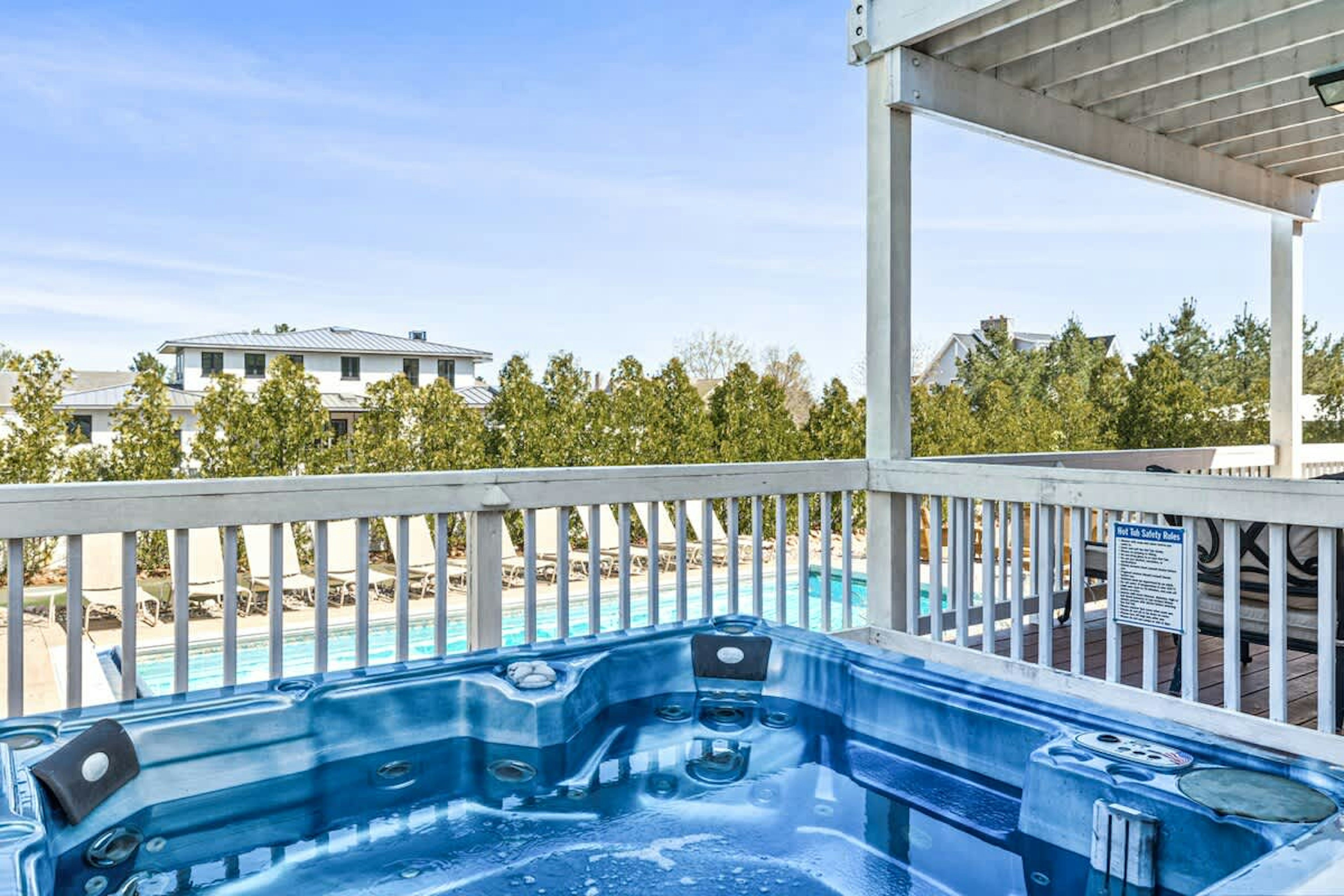 Soak in style with pool views and blue skies all around.
