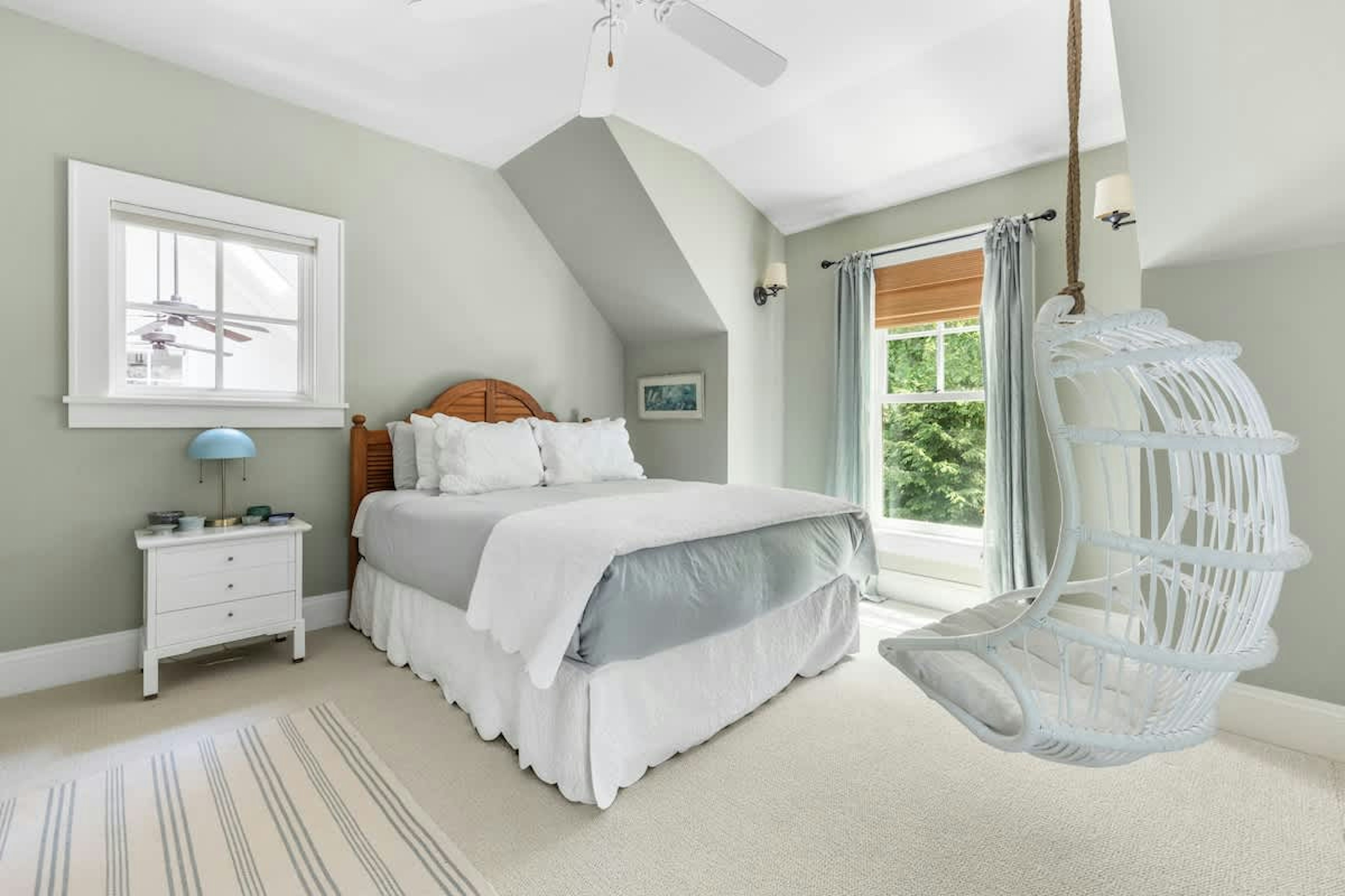Swing into relaxation in this comfort bedroom with a playful twist.