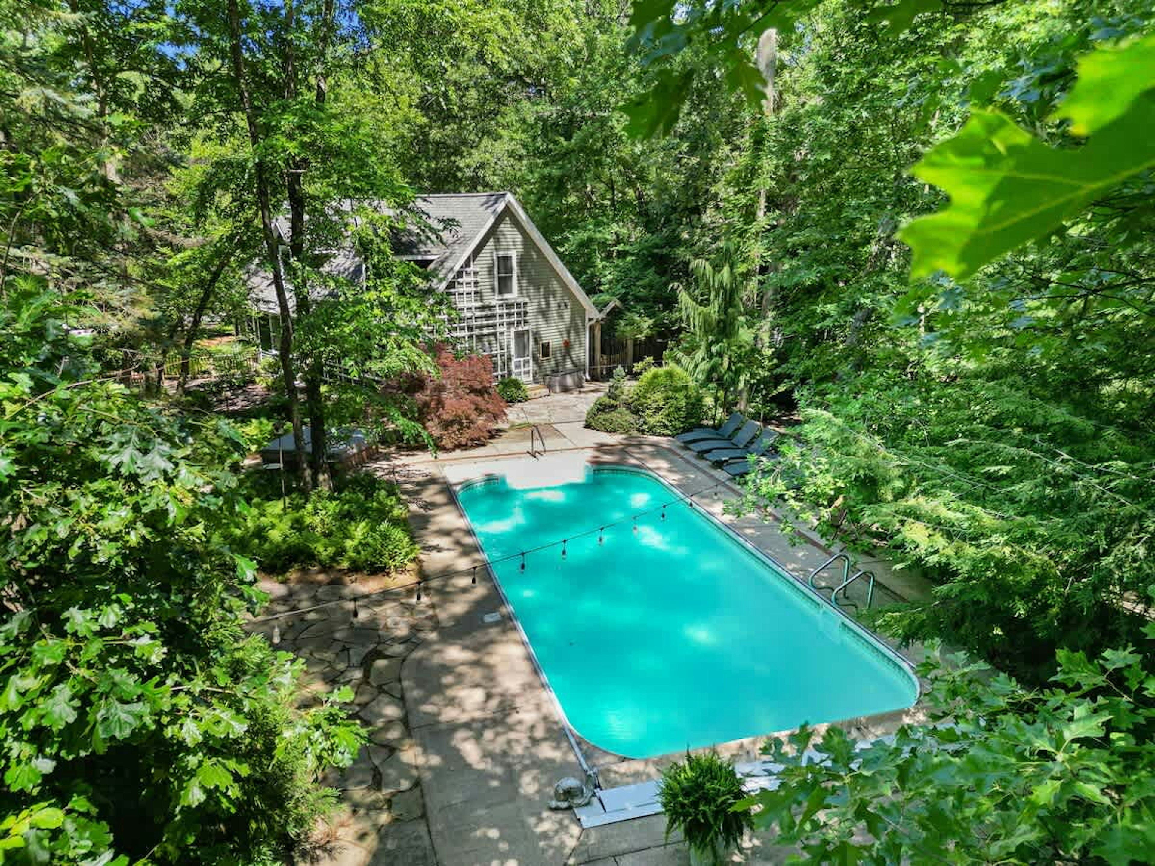 Welcome to Oasis in the Woods—your secluded spa + pool escape.