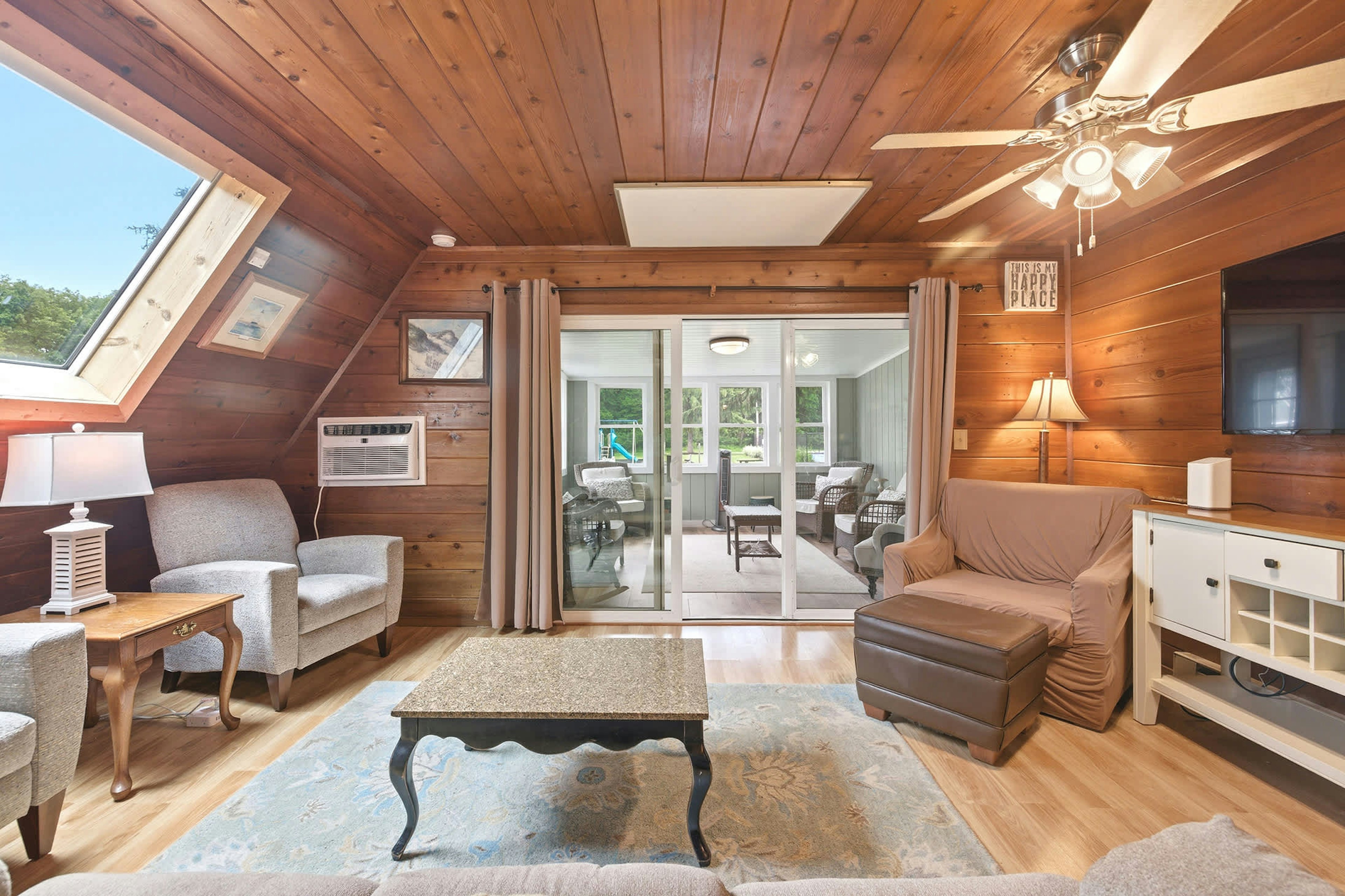 The living area connects directly to the sunroom, creating extra space to spread out.