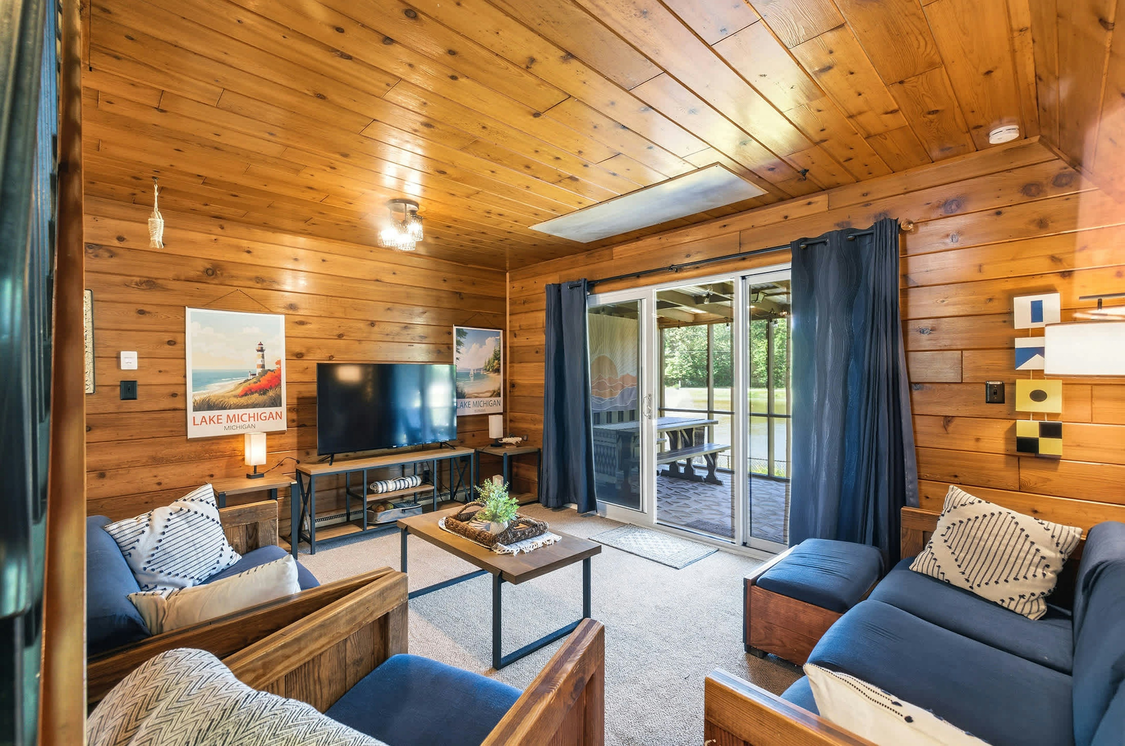 Living room with screened porch access for extended gathering space.
