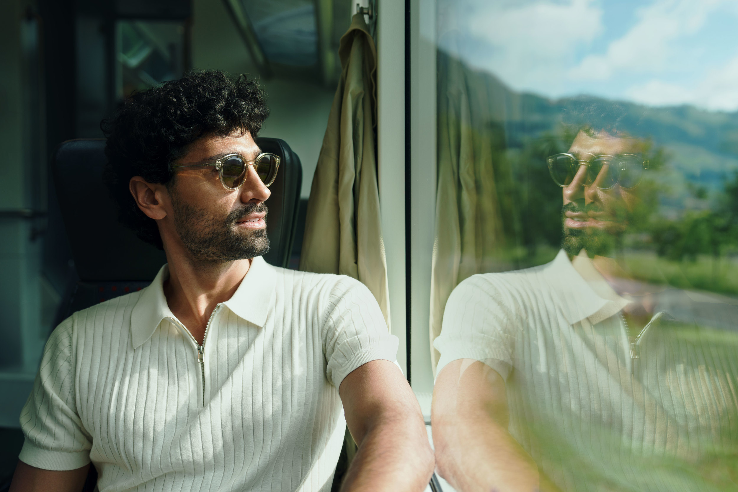 1st class traveller looking outside the window of a panoramic train