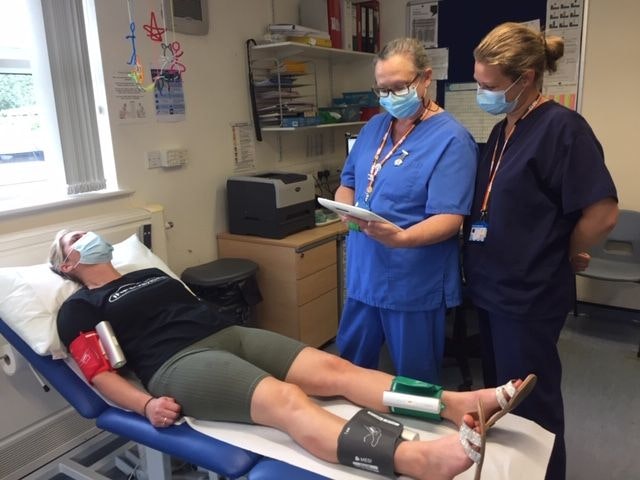 Nurses performing MESI mTABLET ABI measurement