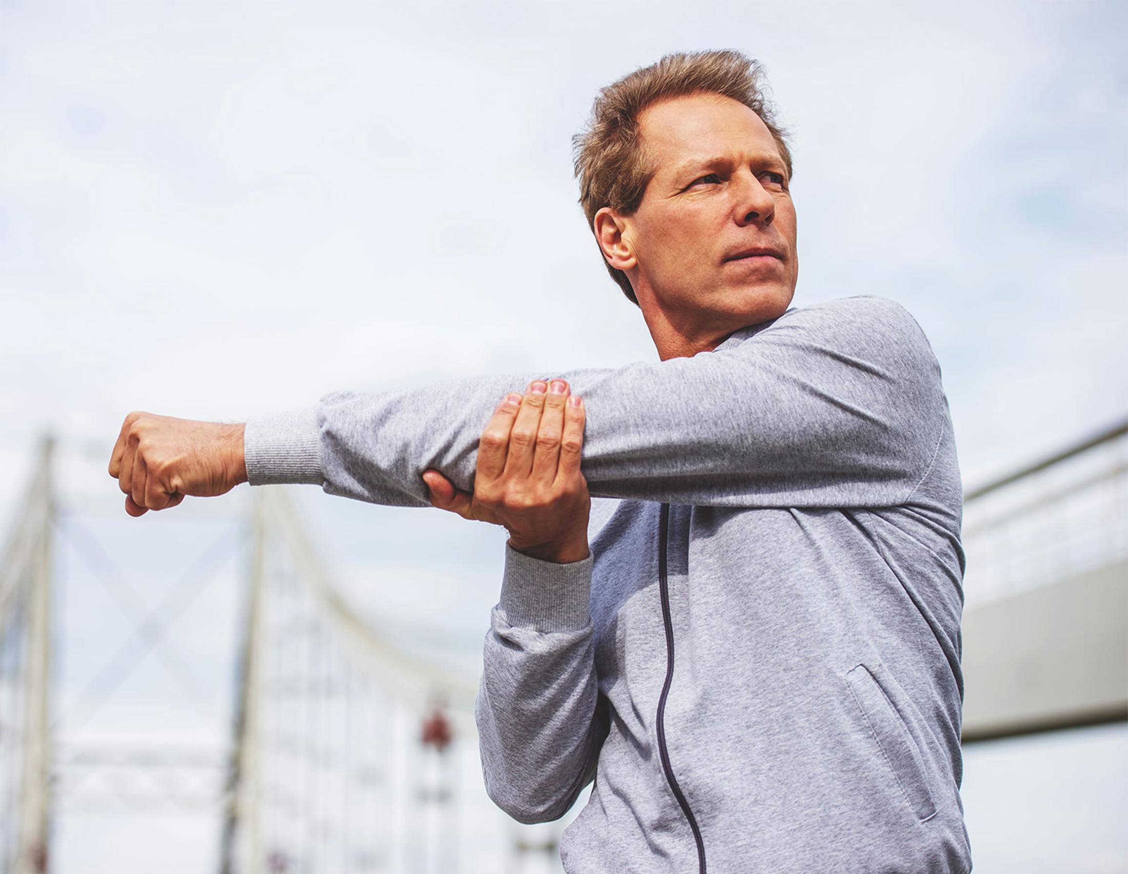 Man stretching shoulder