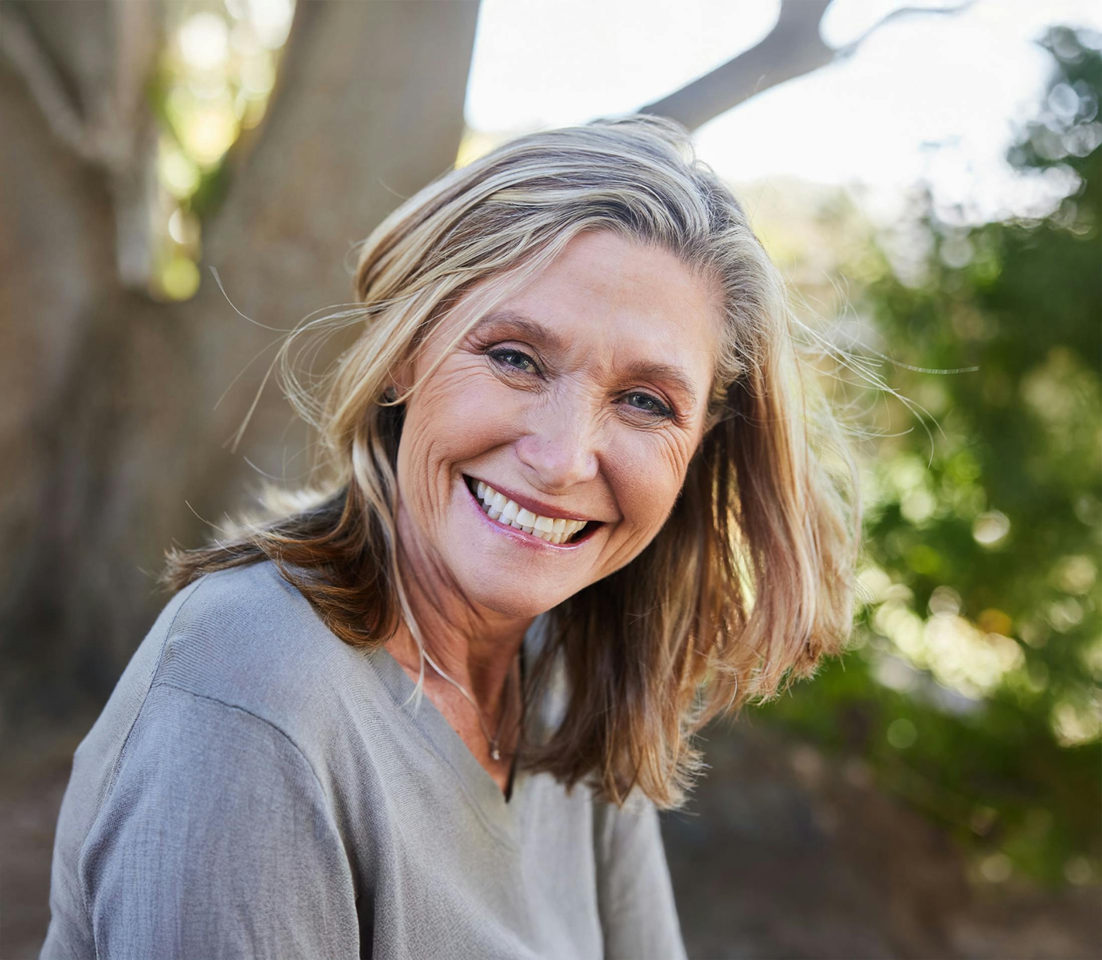 Woman smiling while outside