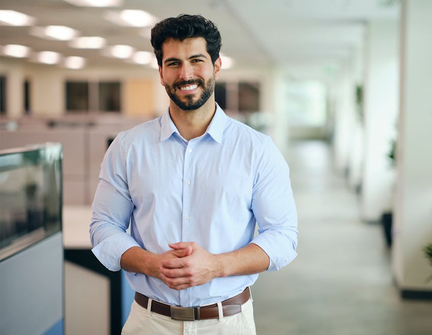 Man smiling in an office