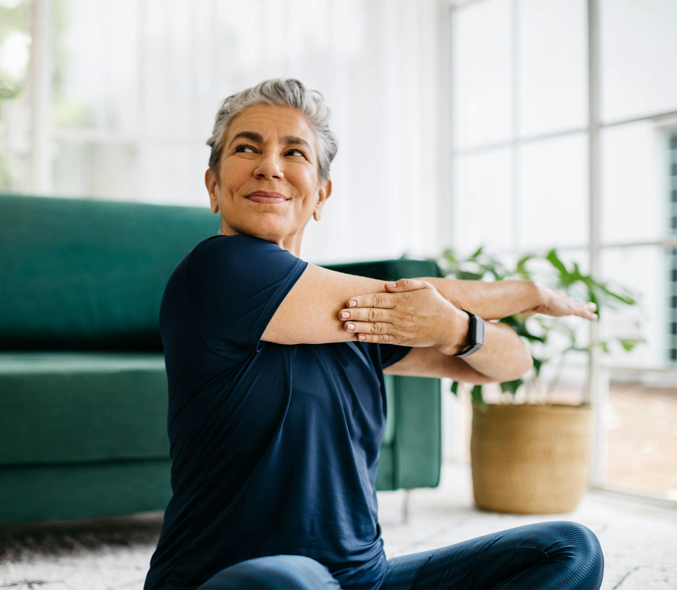 Woman smiling doing yoga
