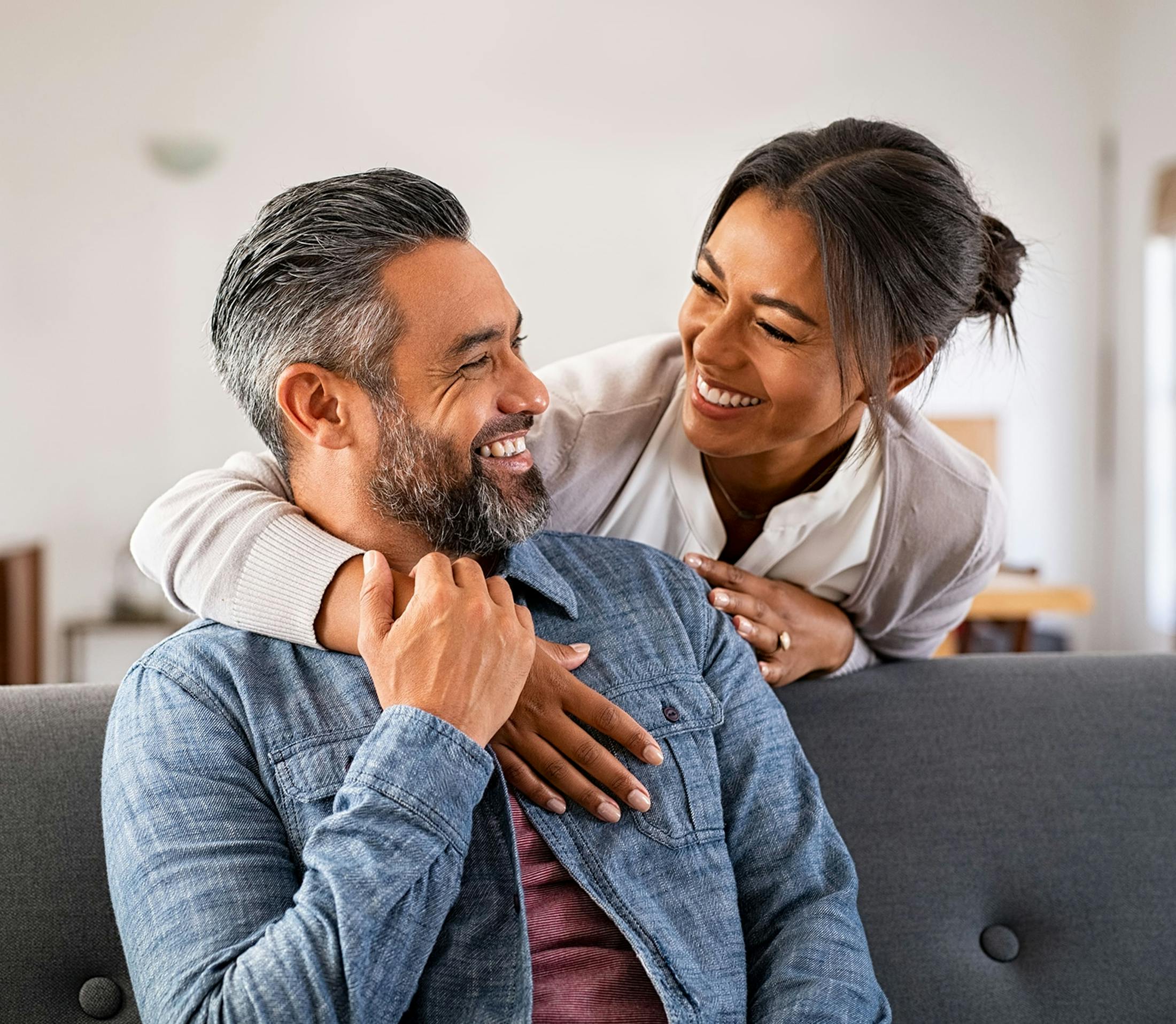 couple smiling on the couch