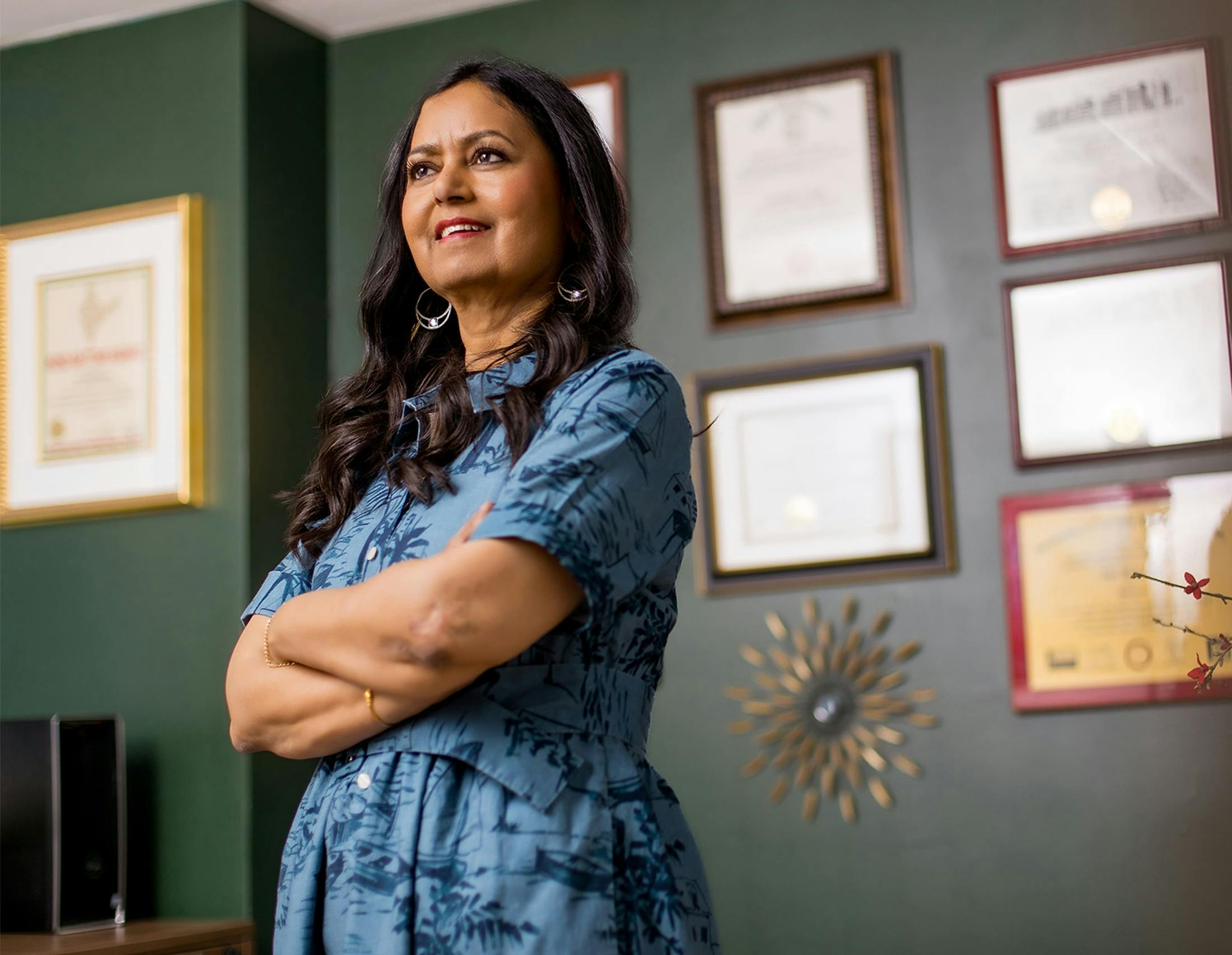 Dr. Mathur standing and smiling