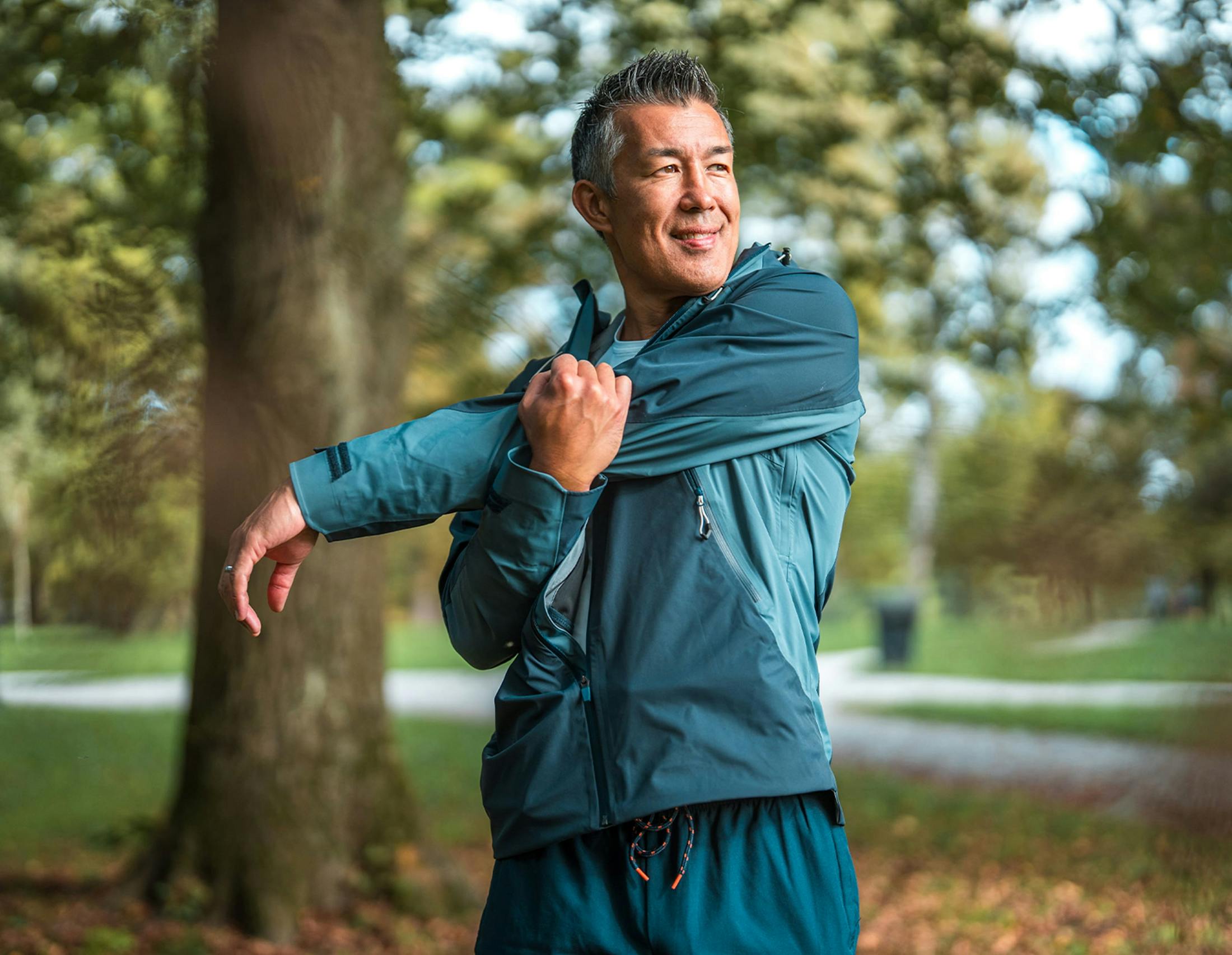 Man stretching and smiling