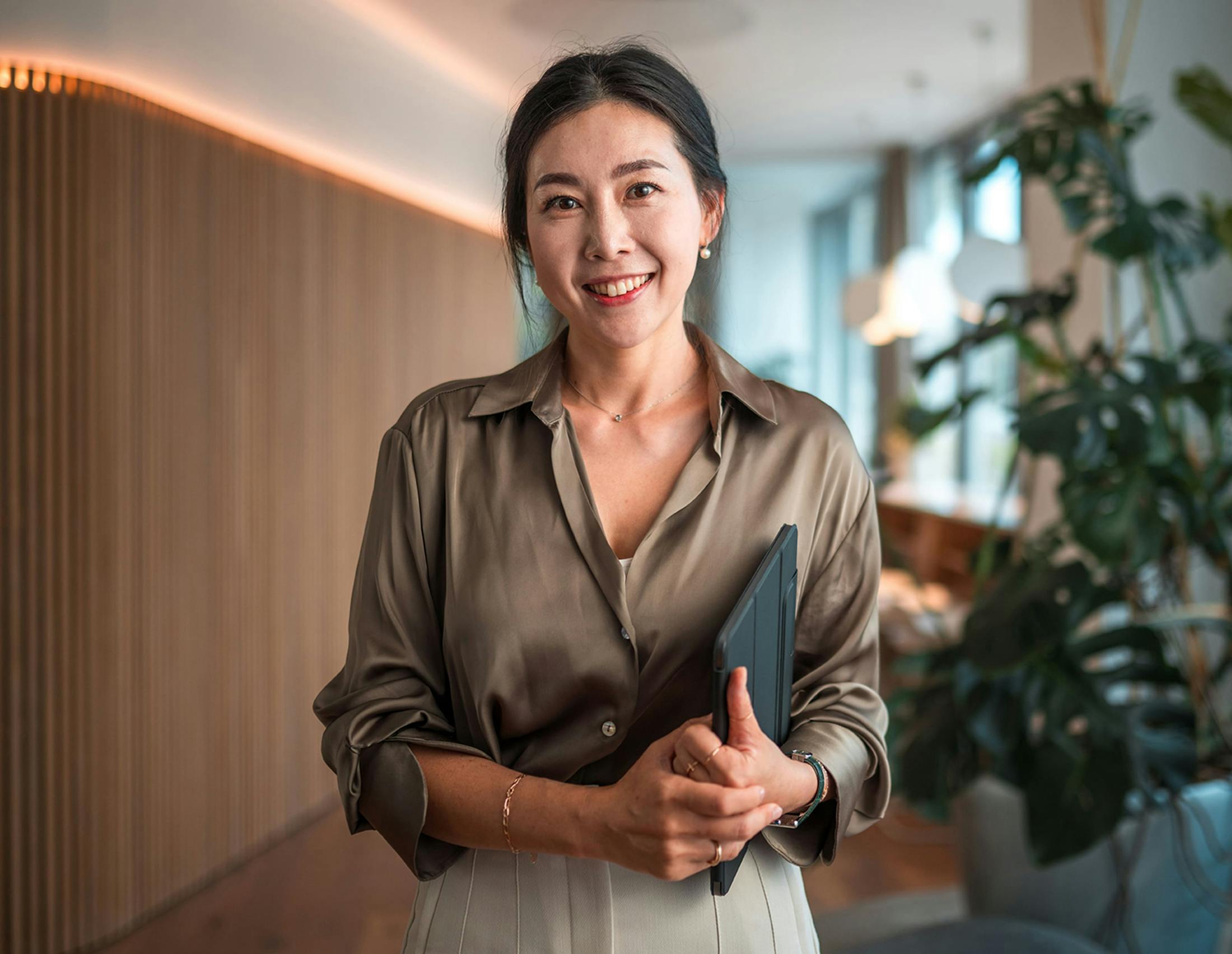 Woman holding tablet smiling