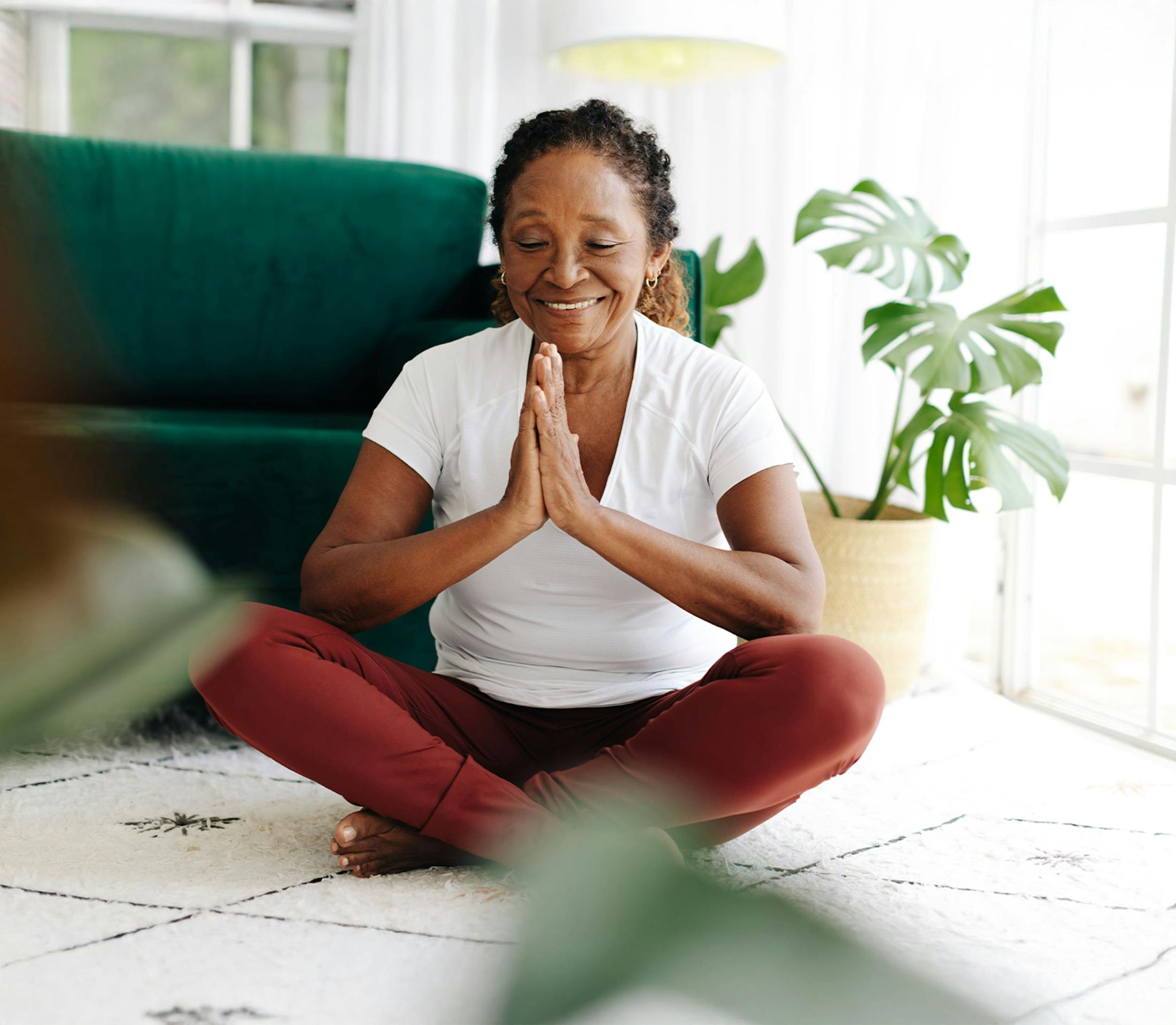Woman doing yoga on her floor
