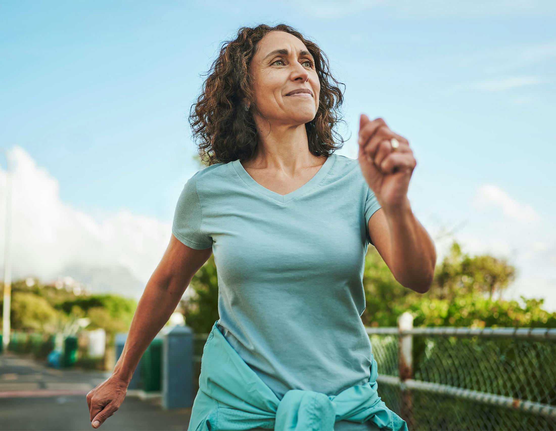 Woman running and smiling